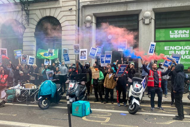 Deliveroo drivers protest outside the company’s AGM (Rebecca Speare-Cole/PA)