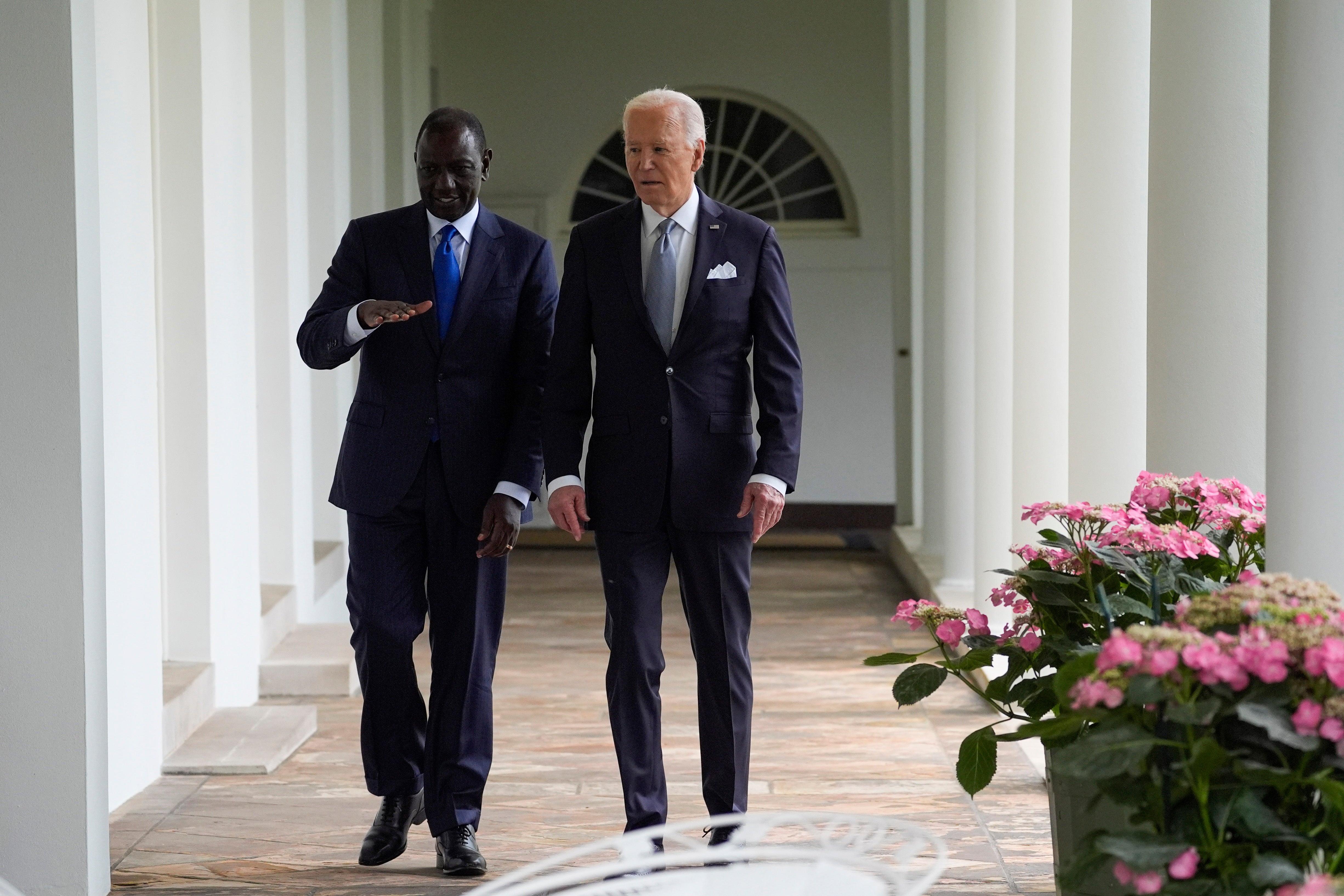 President Joe Biden and Kenya's President William Ruto walk along the Colonnade around the Rose Garden on their way to the Oval Office for a meeting after a State Arrival Ceremony at the White House on Thursday