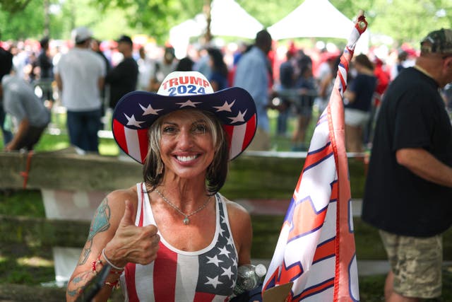 Supporters of former US President Donald Trump attend a campaign rally at Crotona Park in the South Bronx, New York City on May 23