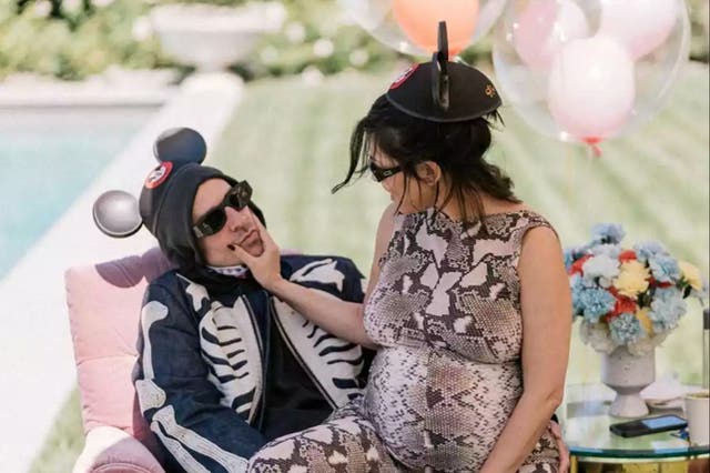 <p>Travis Barker and Kourtney Kardashian Barker posed together during their Disneyland-themed baby shower in September 2023 (@kourtneykardash/Instagram)</p>