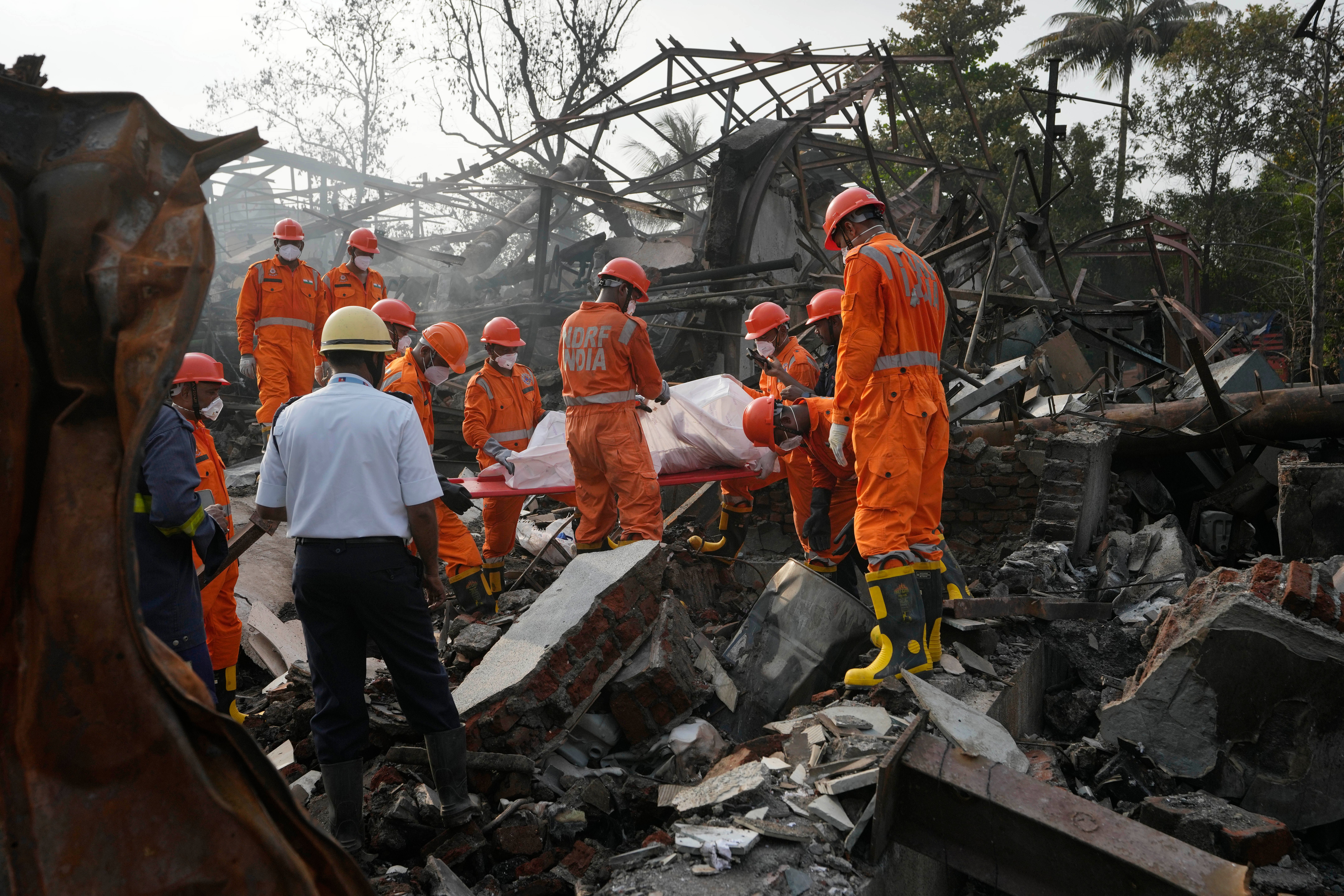 India’s National Disaster Relief Force carry out rescue operations after a factory fire in Thane