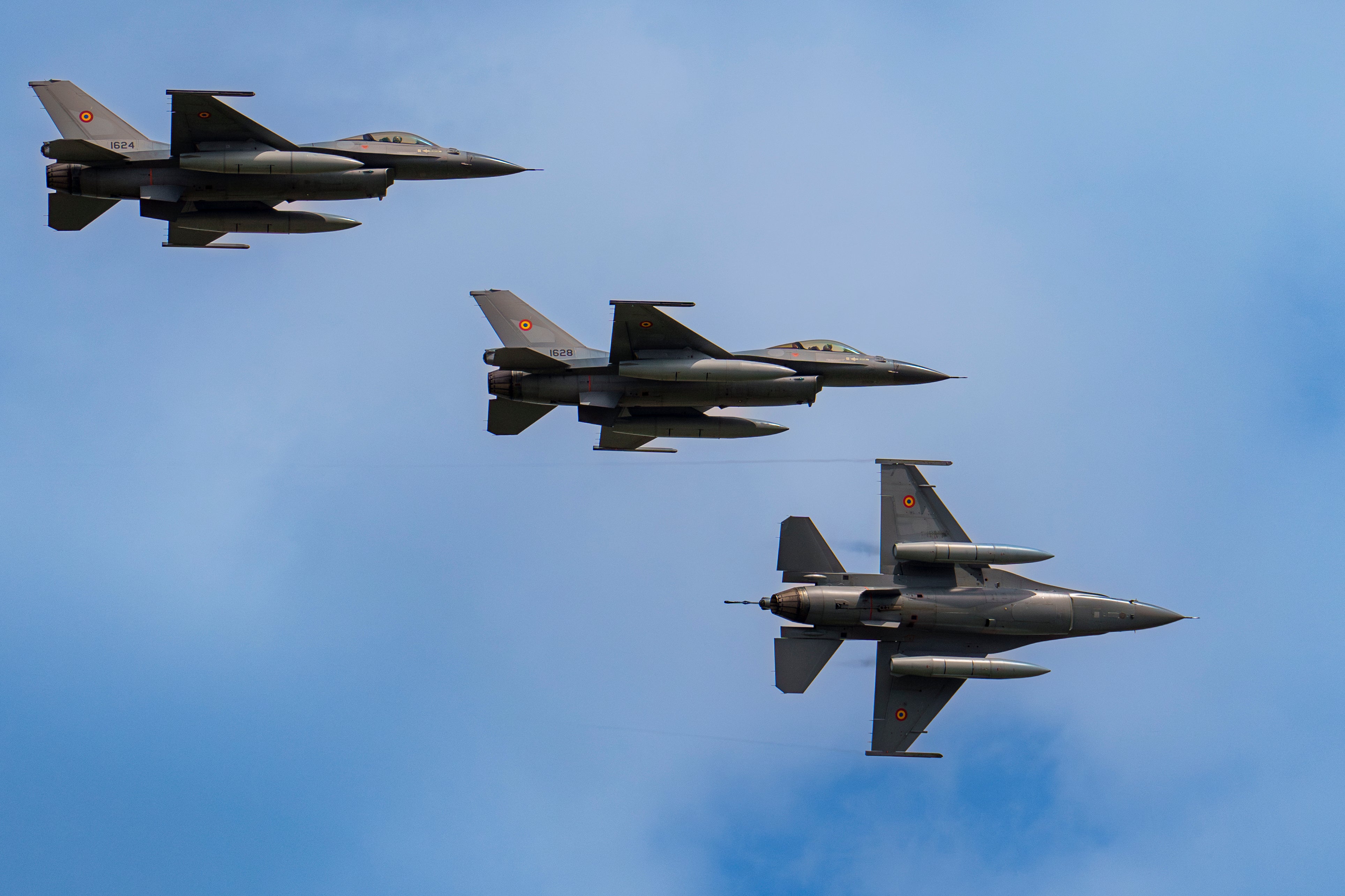 F-16 fighter jets of the Romanian Air Force perform a fly by at the Black Sea, Defense, Aerospace and Security (BSDA) international exhibition in Bucharest