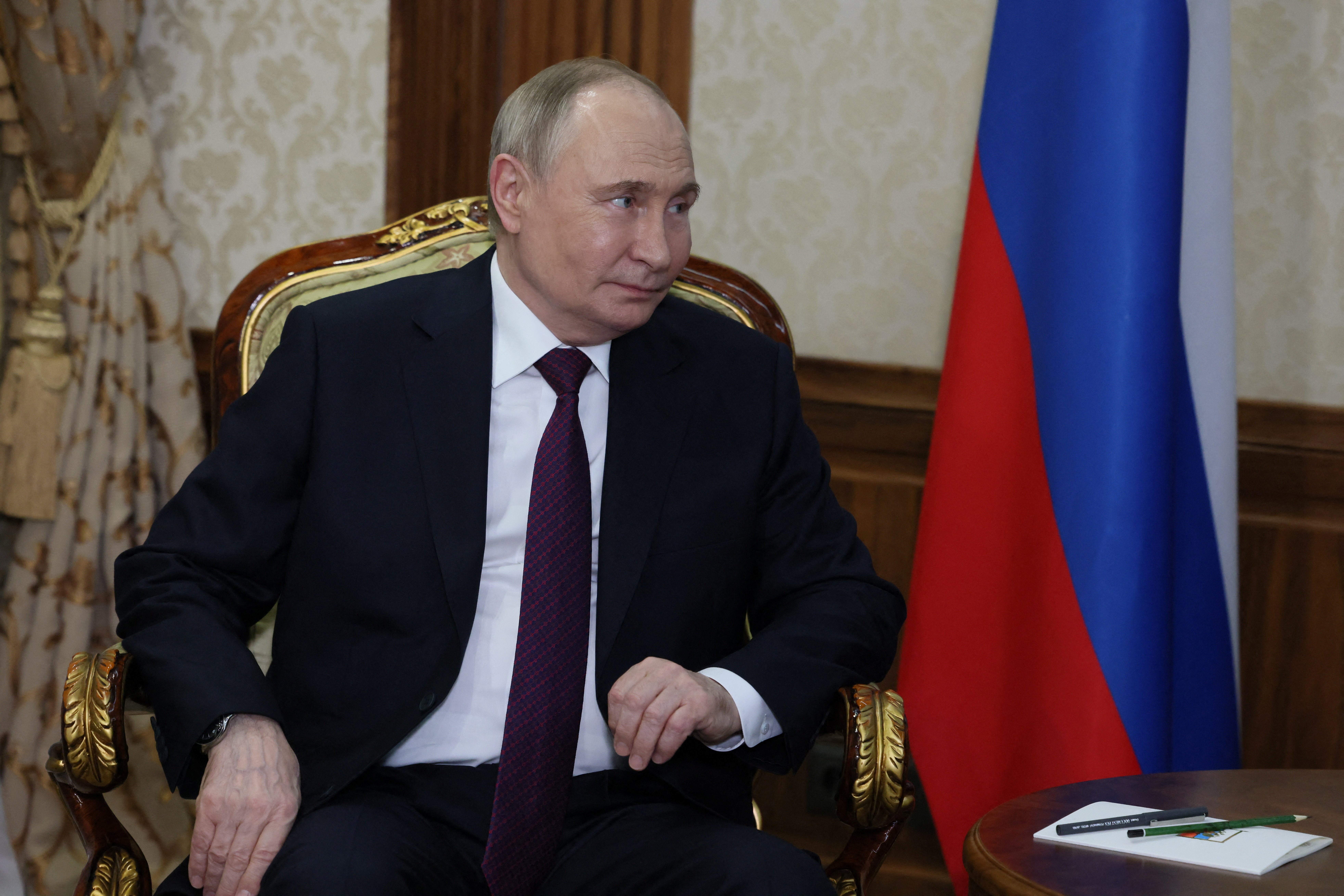 Russian President Vladimir Putin looks on during a meeting with Belarusian President Alexander Lukashenko (not pictured) in Minsk
