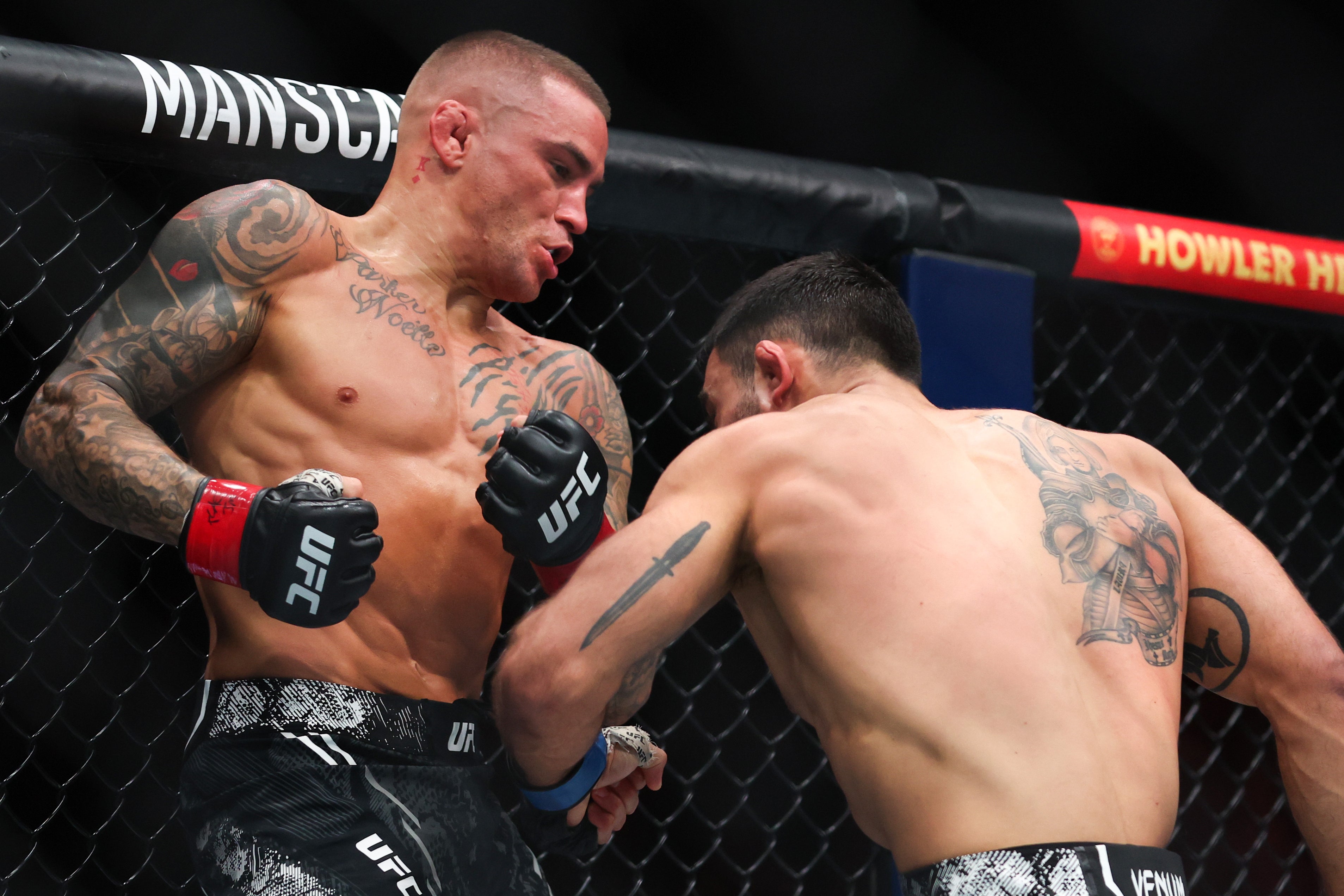 Dustin Poirier (left) knocked out Benoit Saint-Denis in round two in March