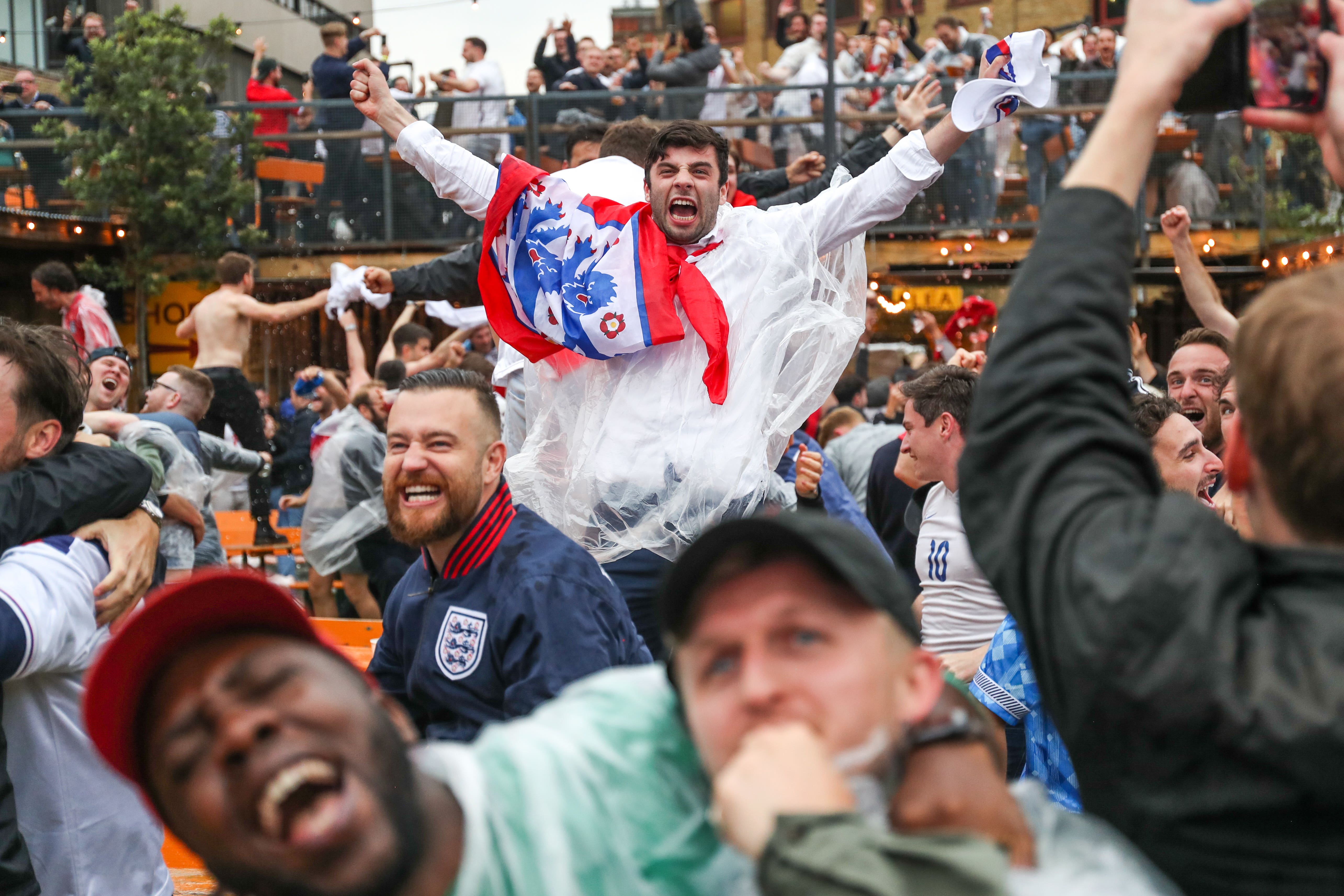 Fans celebrate during the UEFA Euro 2020 round of 16 match between England and Germany at the Vinegar Yard pub in London (Kieran Cleeves/PA)