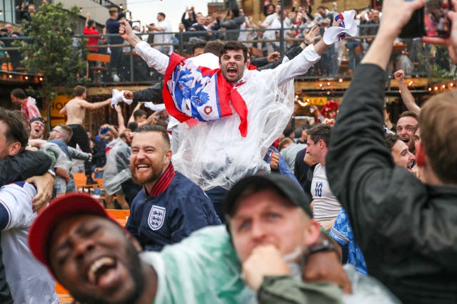 Fans celebrate during the UEFA Euro 2020 round of 16 match between England and Germany at the Vinegar Yard pub in London (Kieran Cleeves/PA)