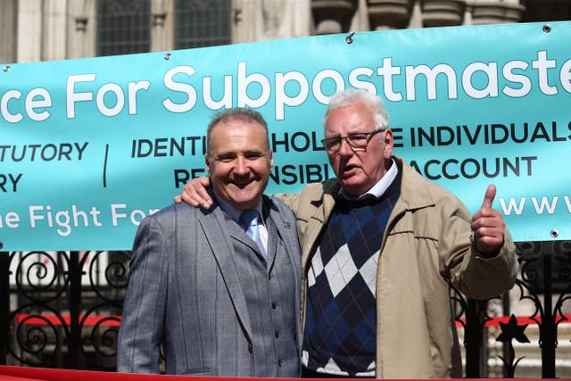 Lee Castleton (left) and Noel Thomas celebrating outside the Royal Courts of Justice, London, after their convictions were overturned (Yui Mok/PA)