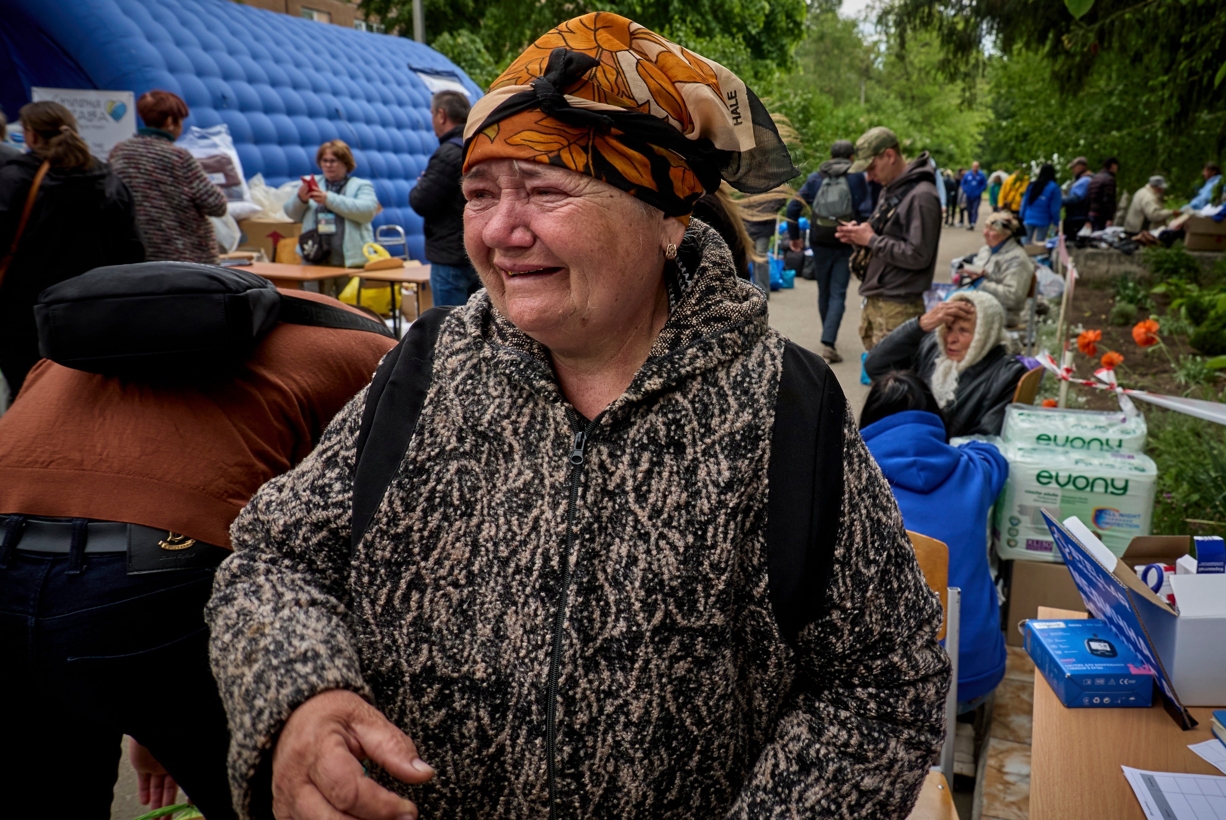 A Ukrainian woman forced to leave her home breaks down in tears at the evacuation centre in Kharkiv
