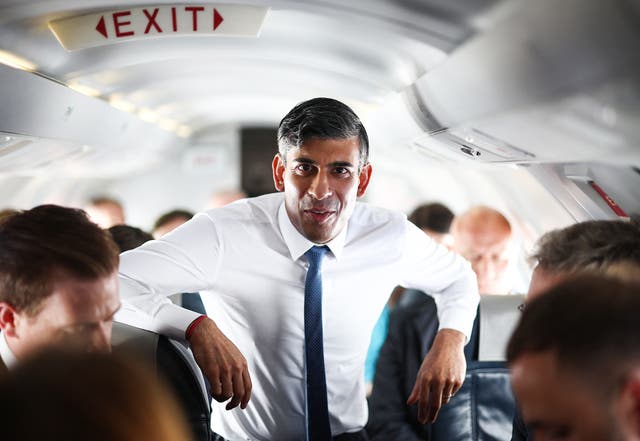 <p>Rishi Sunak speaks to journalists on the plane on Friday </p>