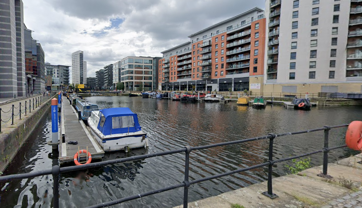 Emergency services were called after a woman entered the water near Clarence Dock