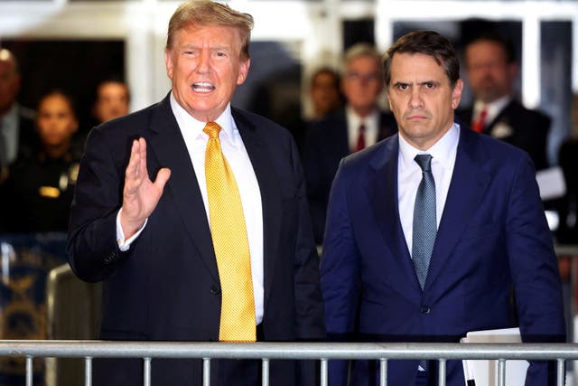 <p>Former US president Donald Trump speaks alongside his attorney Todd Blanche during his hush money trial at Manhattan Criminal Court on May 21 2024</p>