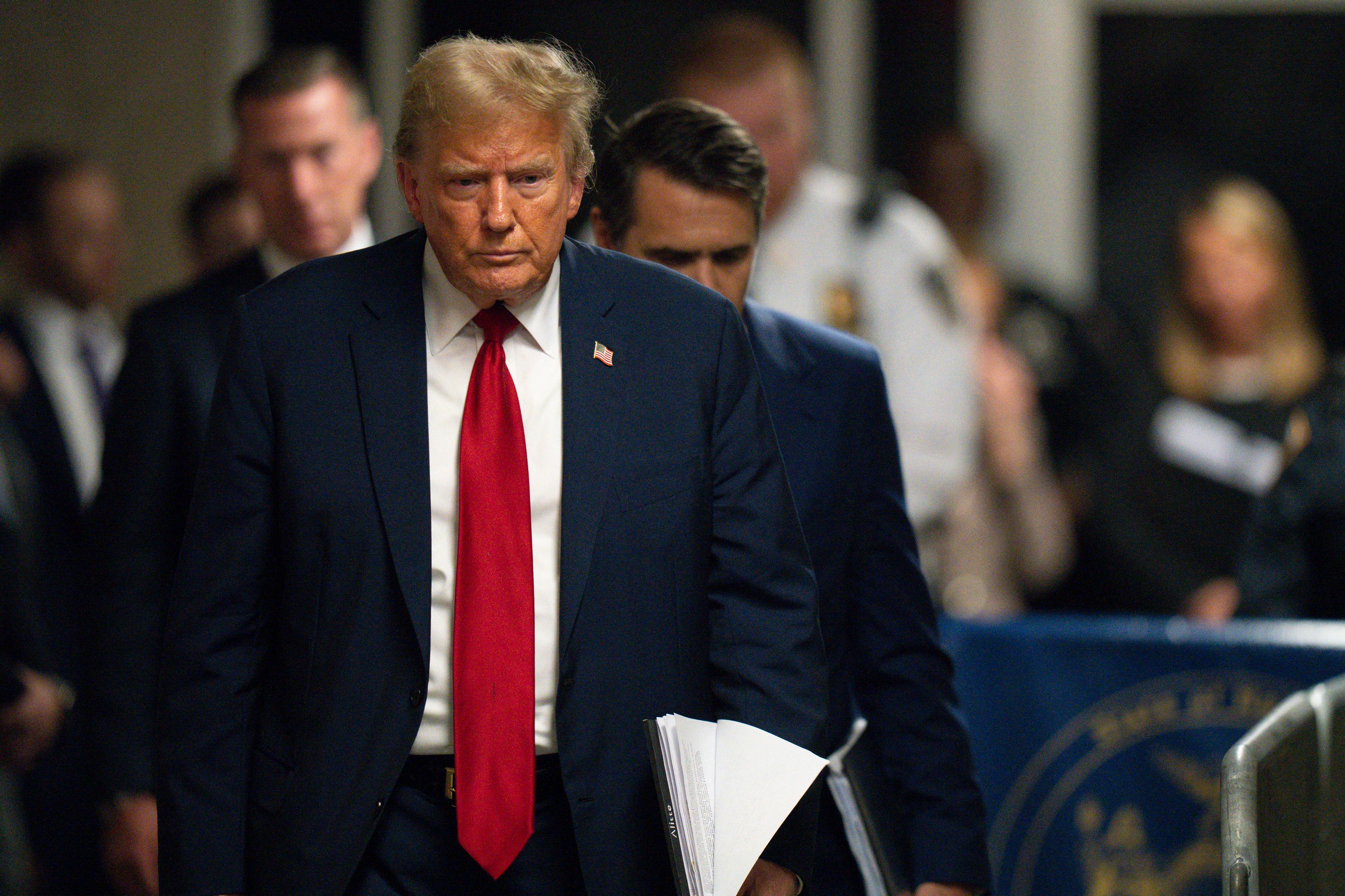 Donald Trump leaves a Manhattan criminal courtroom to speak with reporters on May 16.