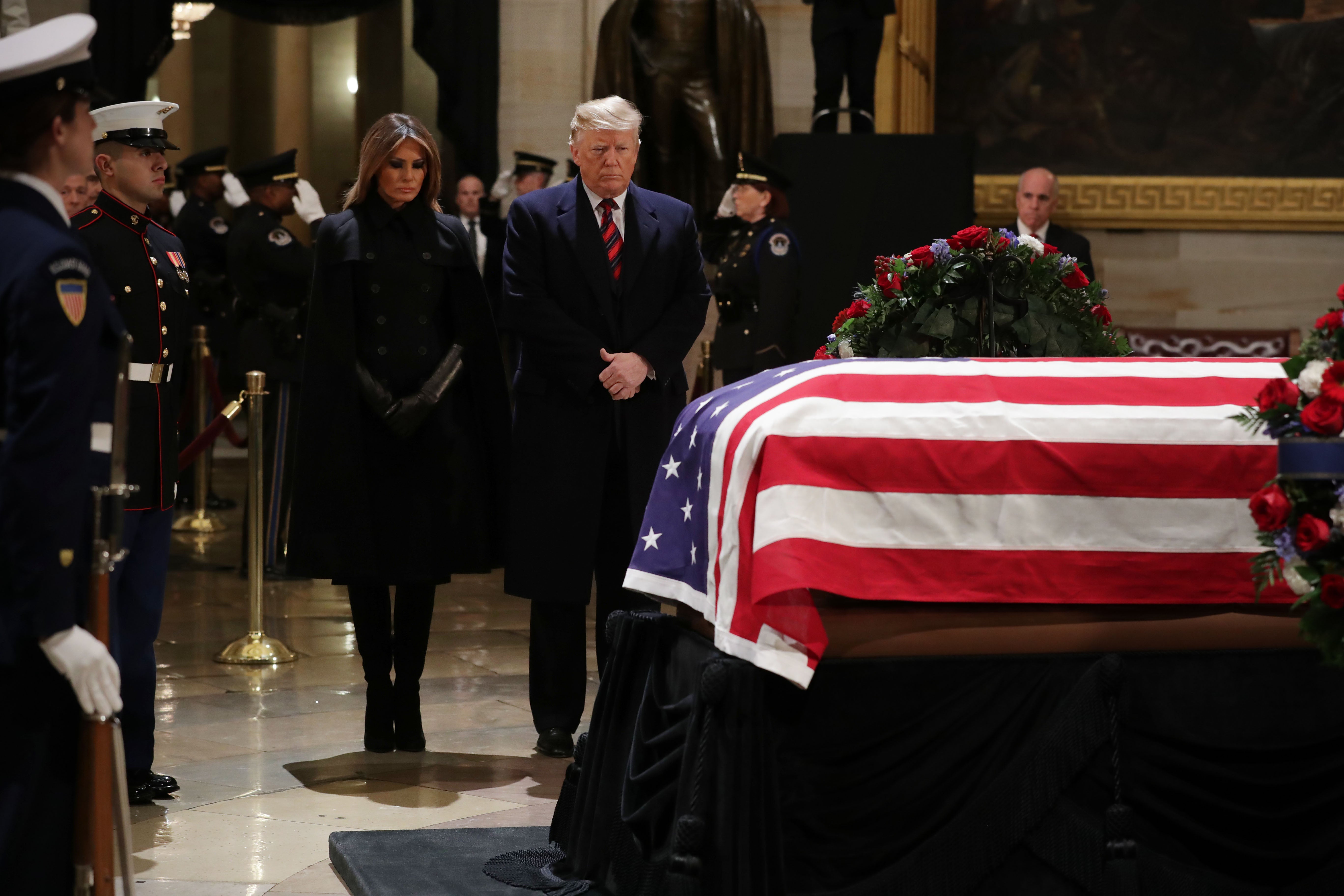 President Donald Trump and first lady Melania Trump pay their respects as former President George HW Bush lies in state in the Capitol Rotunda on 3 December, 2018 in Washington, DC