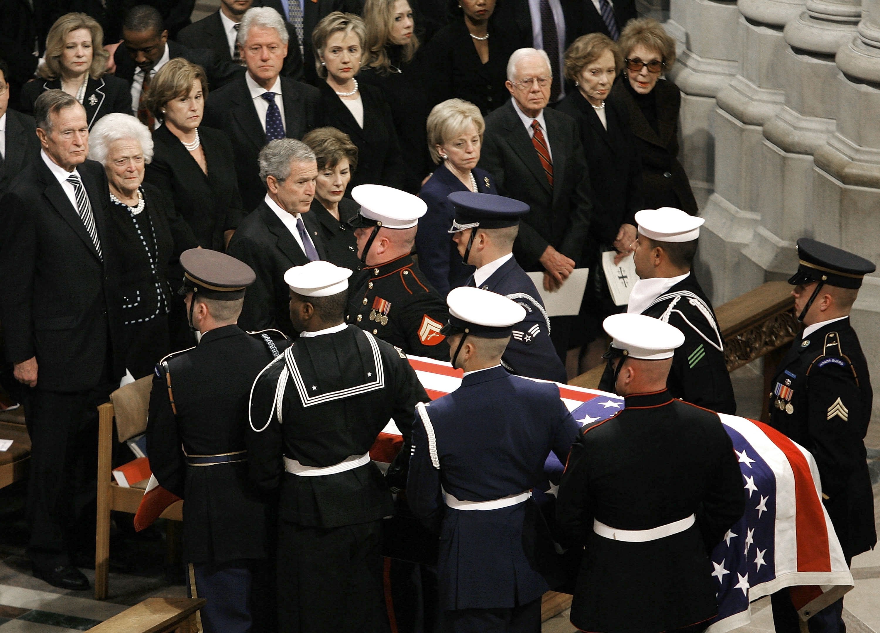 A military honor guard carries the casket of former President Gerald Ford during a funeral service on 2 January, 2007 in Washigton DC