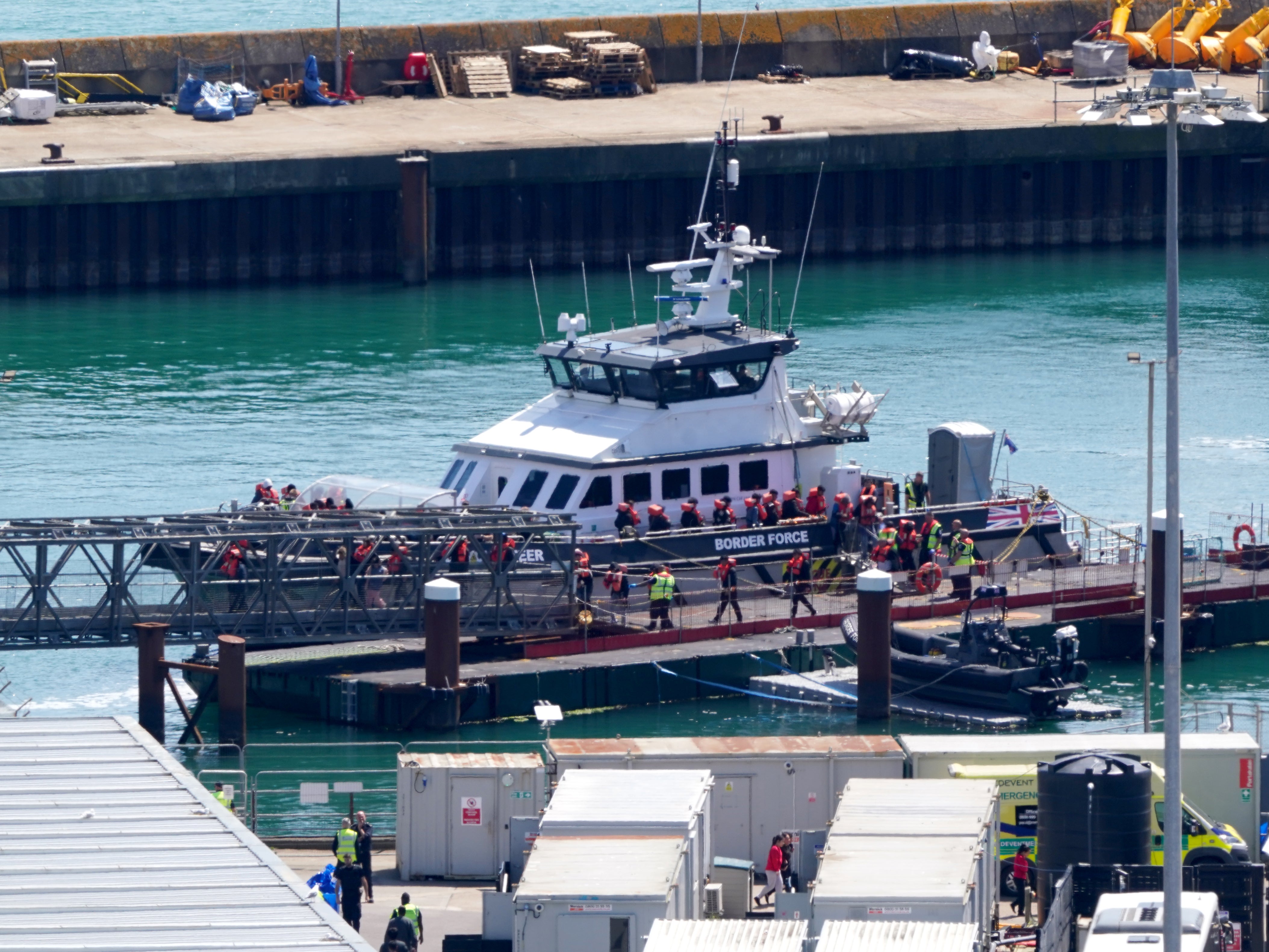 A group of people thought to be migrants are brought in to Dover, Kent, from a Border Force vessel following a small boat