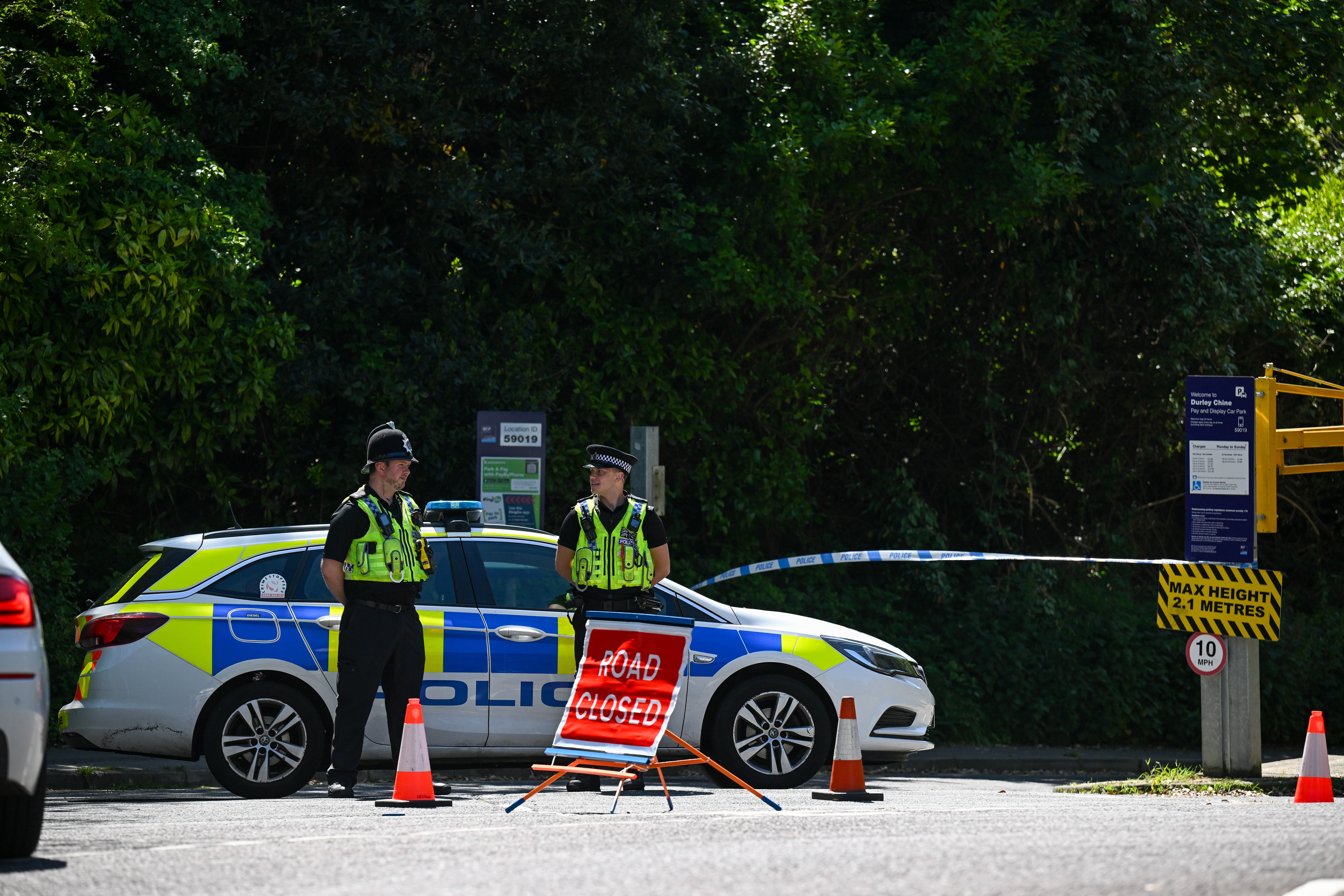 Police blocked a road to the beach on Saturday as investigations continued