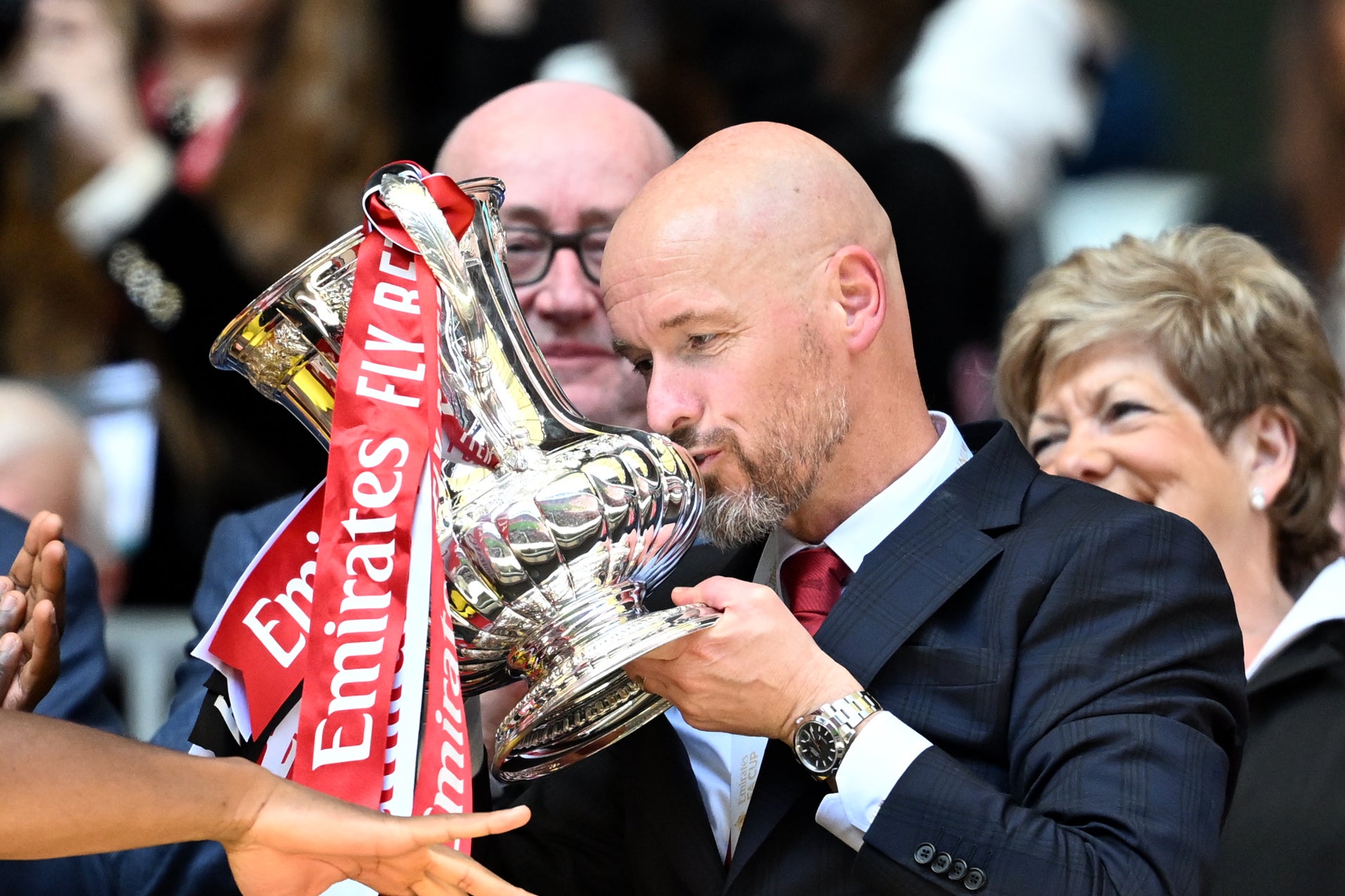 Erik ten Hag kisses the FA Cup trophy after victory at Wembley