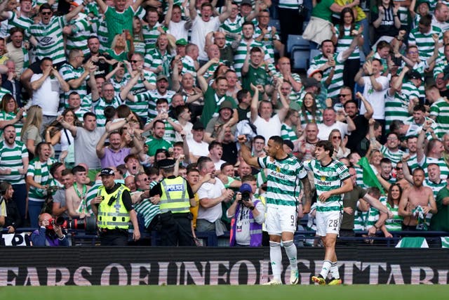 Celtic’s Adam Idah, left, celebrates his cup-winning goal against Rangers (Andrew Milligan/PA)