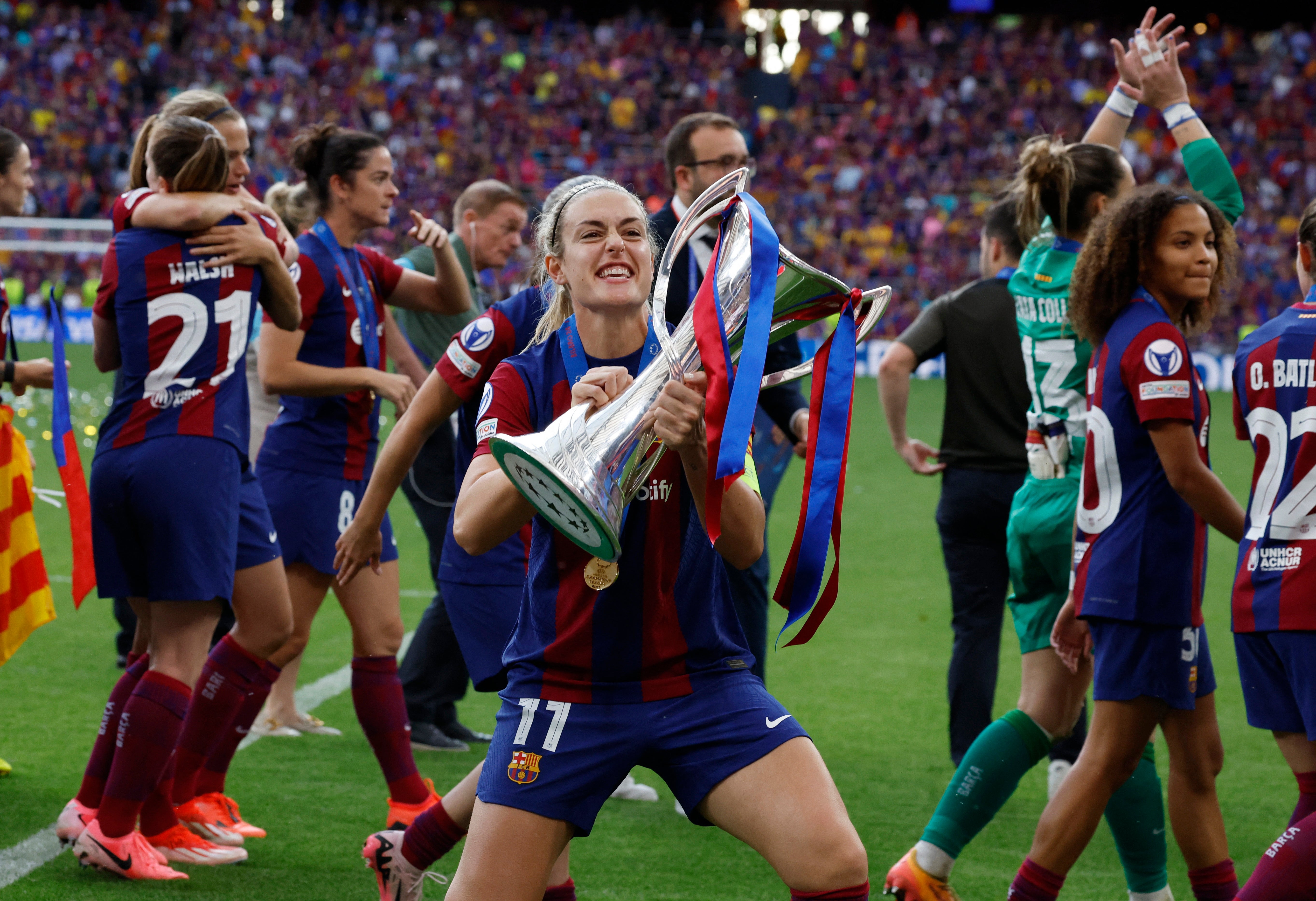 Alexia Putellas celebrates with the Champions League trophy after Barcelona defeated Lyon in Bilbao