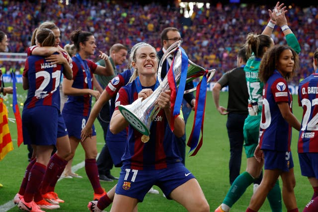 <p>Alexia Putellas celebrates with the Champions League trophy after Barcelona defeated Lyon in Bilbao </p>