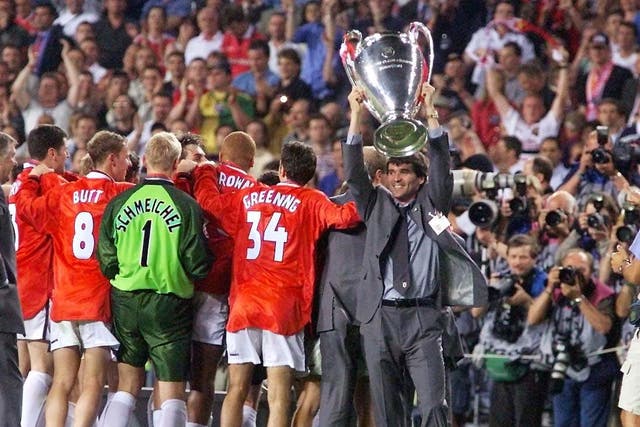 Manchester United’s suspended captain Roy Keane holds the trophy (Owen Humphreys/PA)