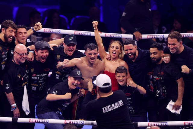 <p>Jack Catterall (centre) and his team celebrate victory over Josh Taylor</p>