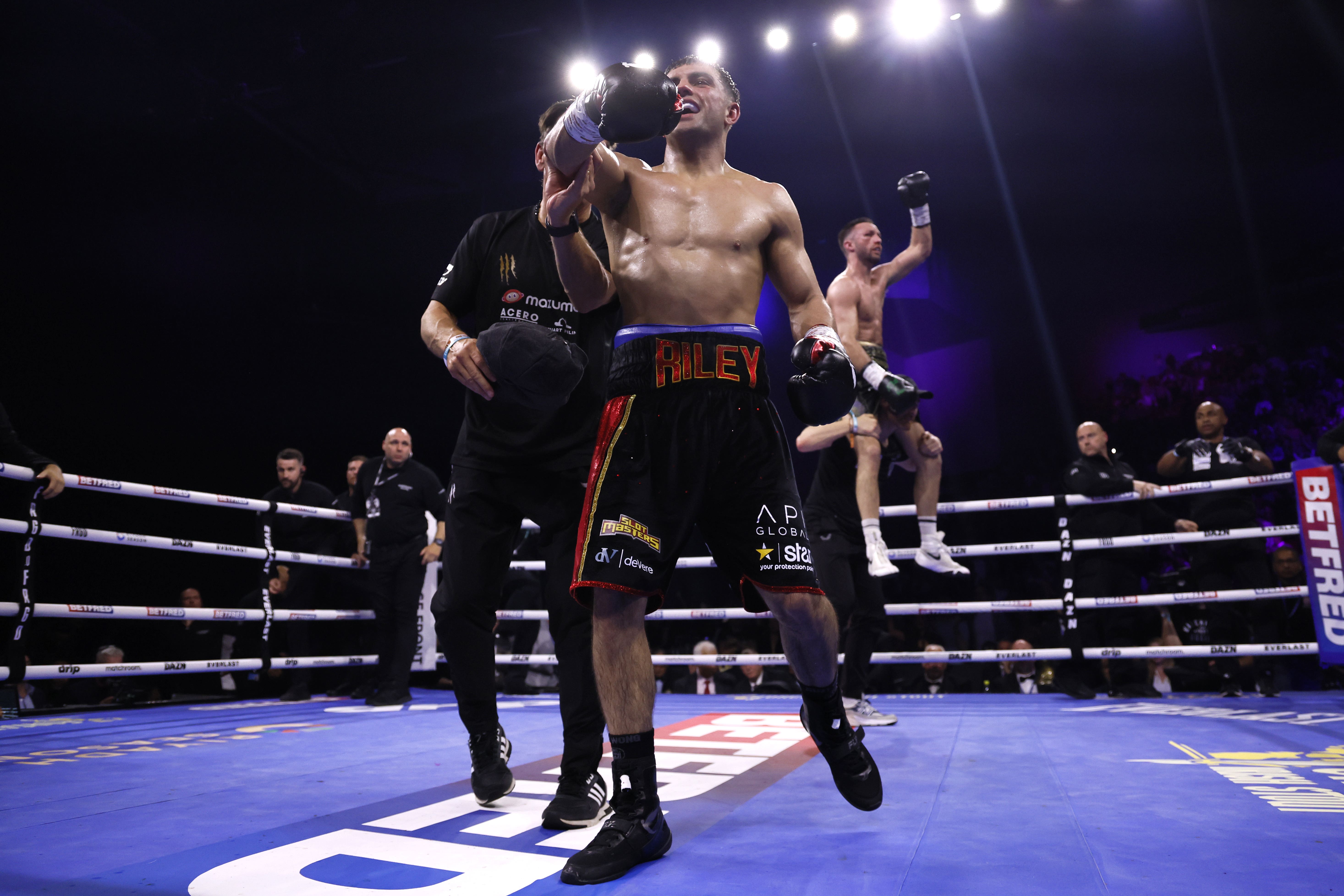 Jack Catterall (left) and Josh Taylor both celebrate following the super lightweight bout in Leeds (Richard Sellers/PA)