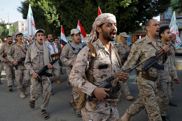 <p>Houthi supporters march in Yemen days before the group claimed to have attacked a US air carrier in the Red Sea </p>