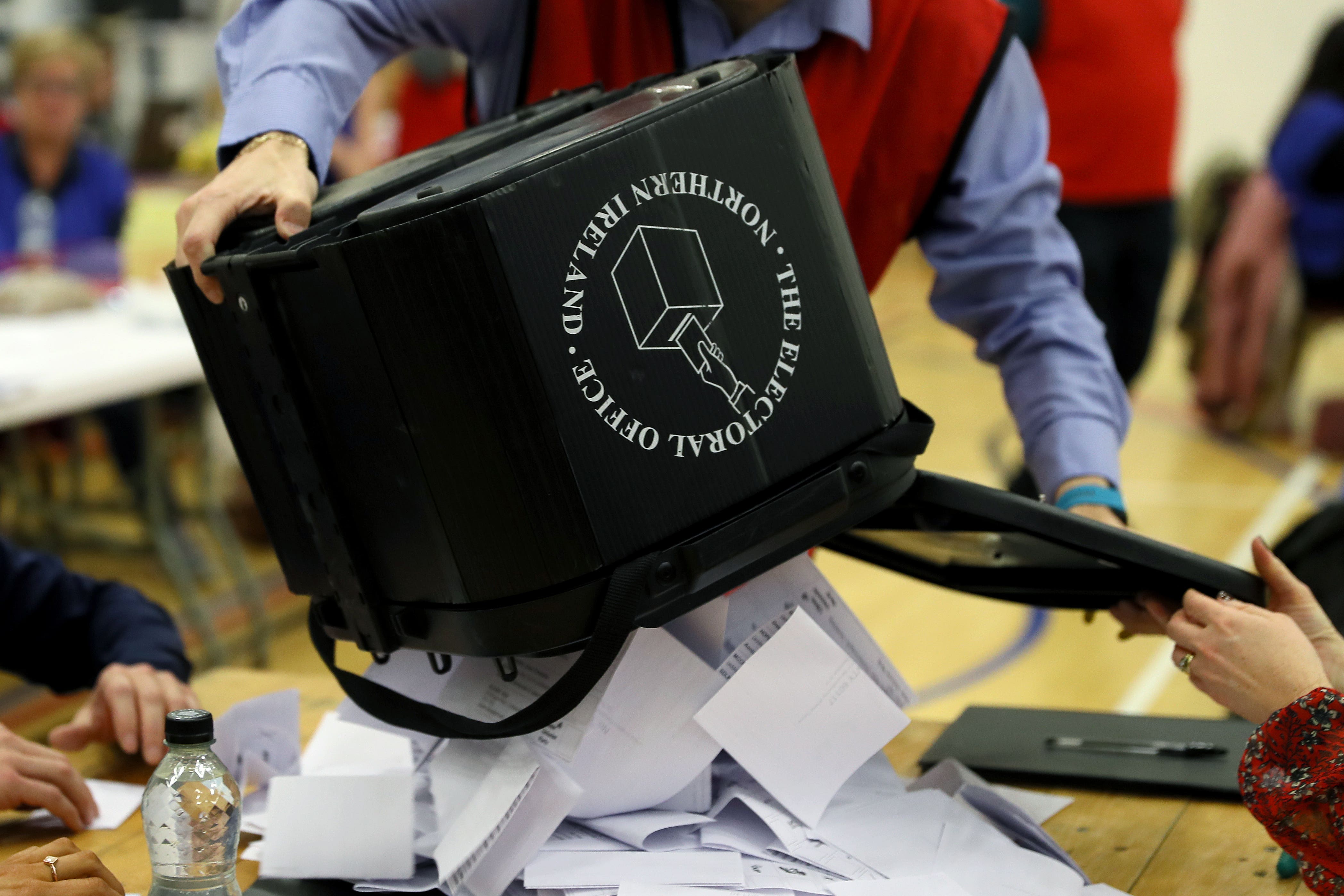 Ballot boxes are opened at in Omagh, Northern Ireland, during the 2019 general election (PA)