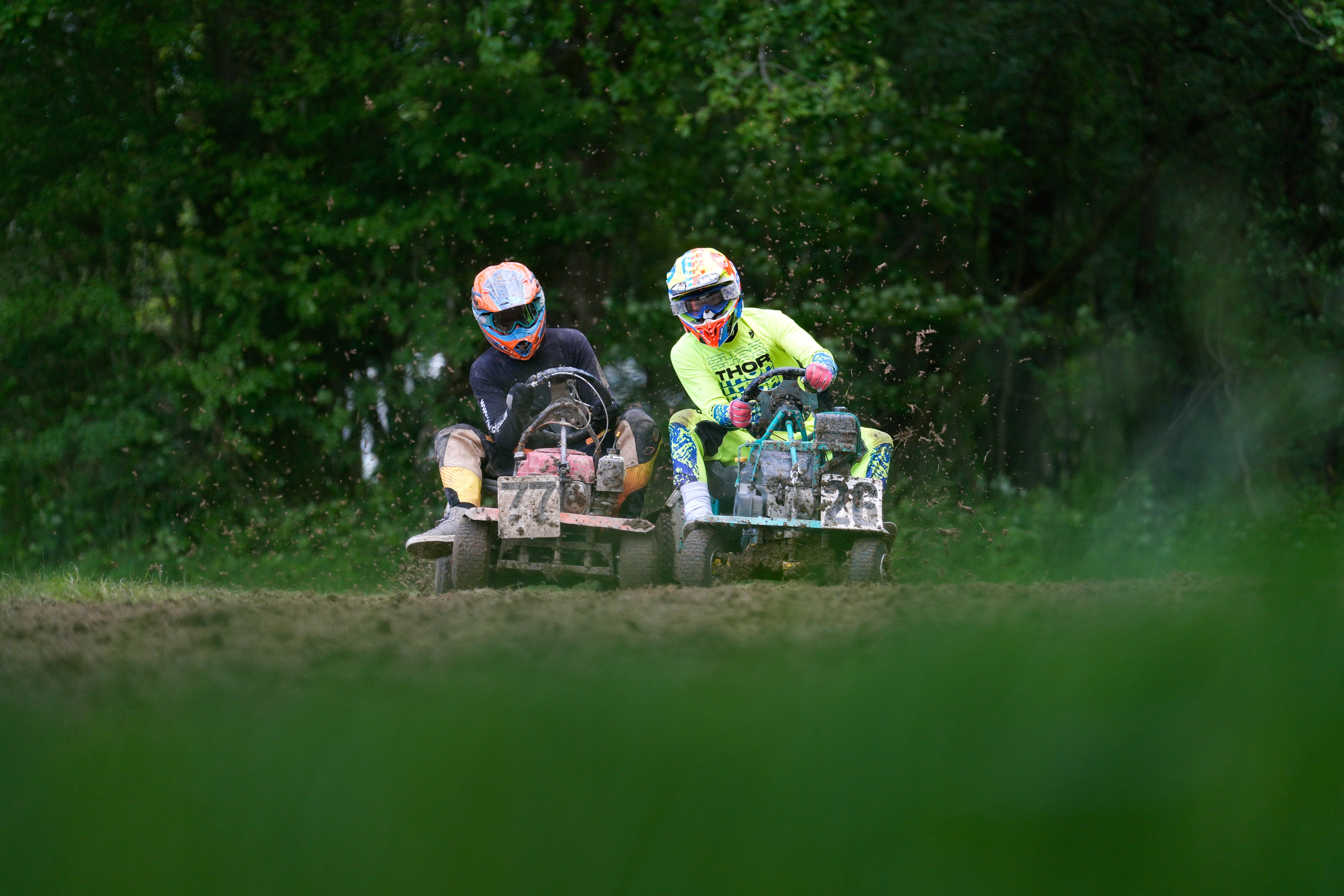 Competitors race in a heat during the World Lawnmower Championships (Andrew Matthews/PA)