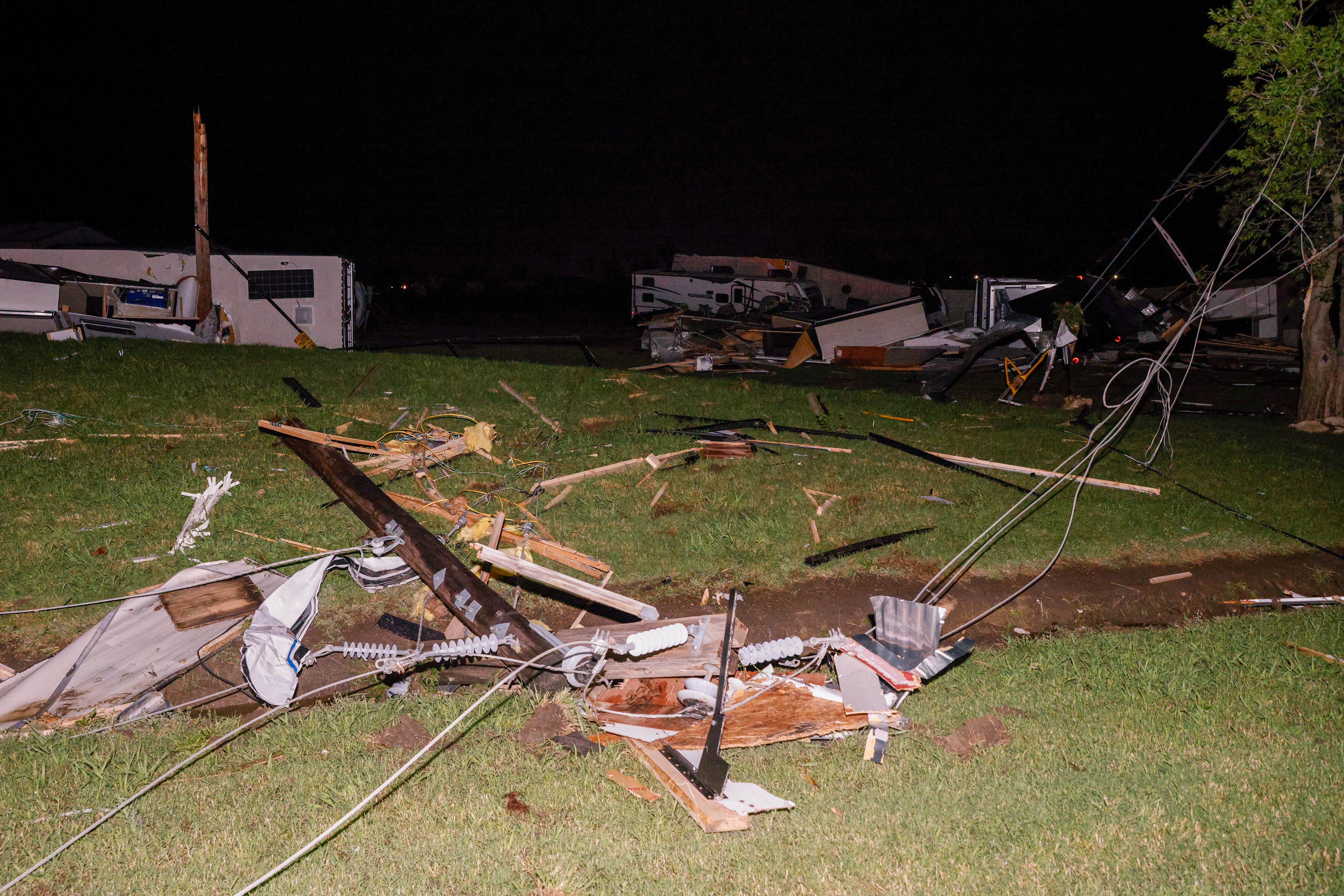 A mangled power line is seen near a recreational vehicle dealership after a suspected tornado moved through the area, Sunday, May 26, 2024, in Valley View, Texas