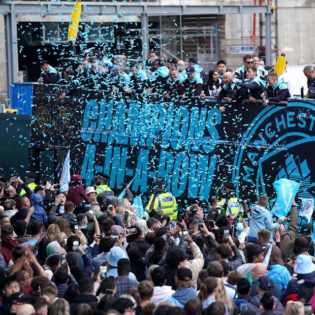 Pep Guardiola and his Manchester City side celebrate their Premier League trophy success (Bradley Collyer/PA).