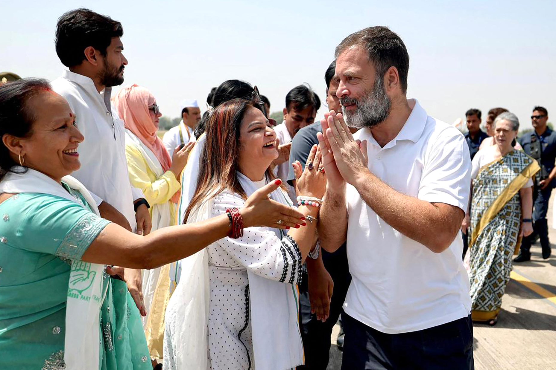 Rahul Gandhi greets his supporters as he arrives at Fursatganj airport in Amethi last month