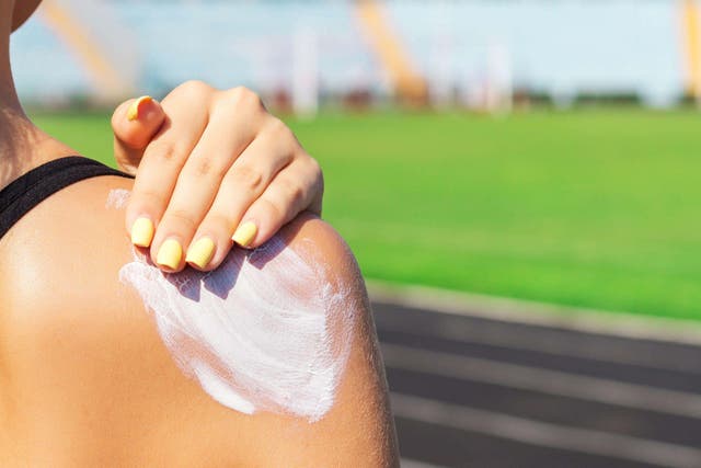 Cancer Research UK recommends using a sunscreen with at least SPF 30 and 4 or 5 stars, applied often (Alamy/PA)