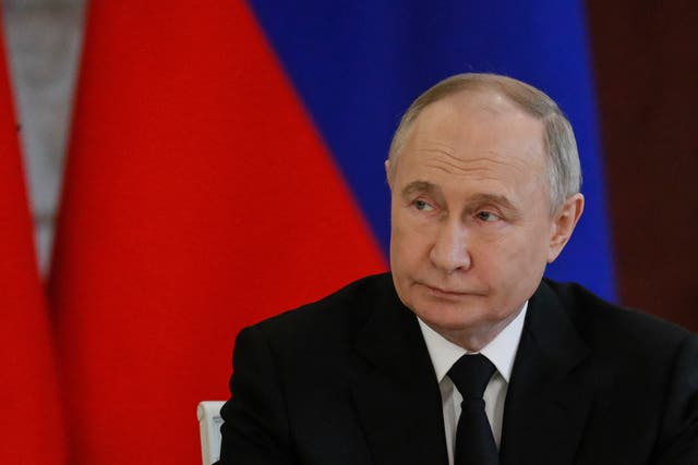<p>Vladimir Putin attends a signing ceremony following talks with Bahrain’s King at the Kremlin in Moscow</p>