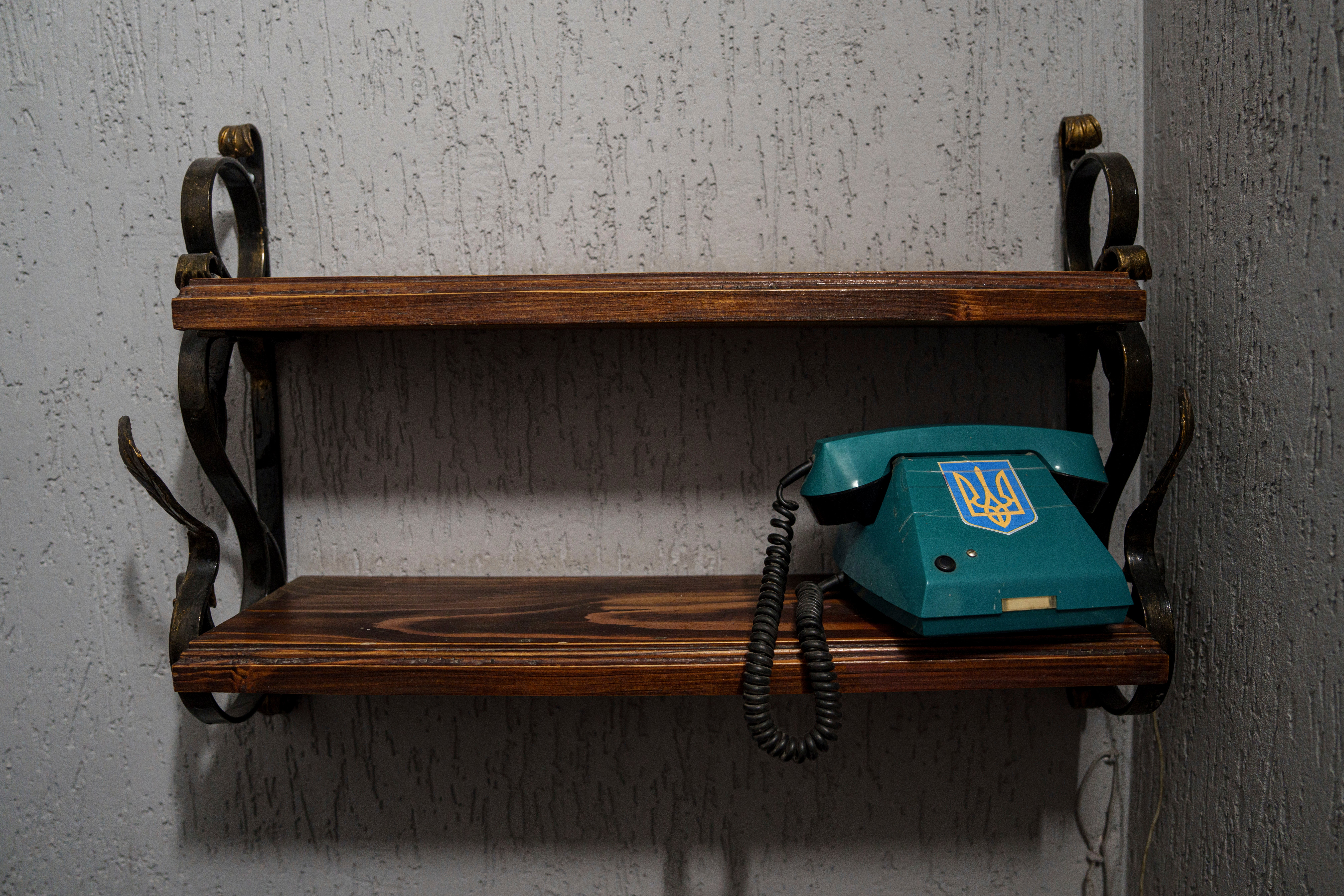 A telephone with a trident, Ukraine’s national symbol, is seen at the prisoner of war detention center in Ukraine