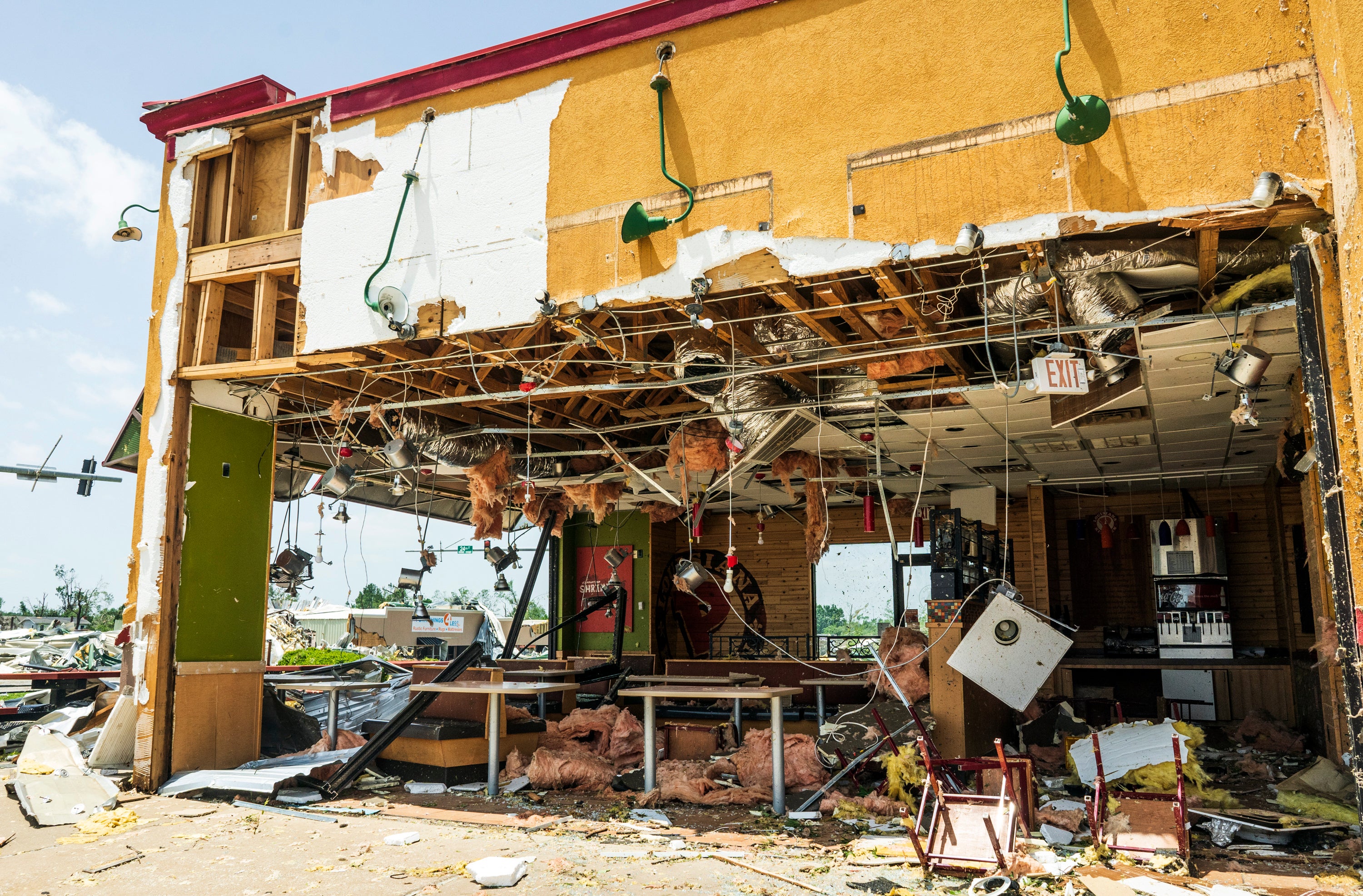A Popeyes location is damaged from the storm at a shopping mall in Rogers, Arkansas