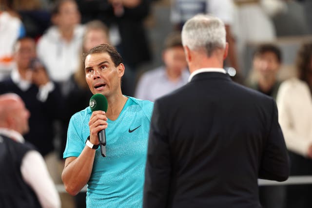 <p>Nadal speaks to the crowd after his straight-sets defeat </p>