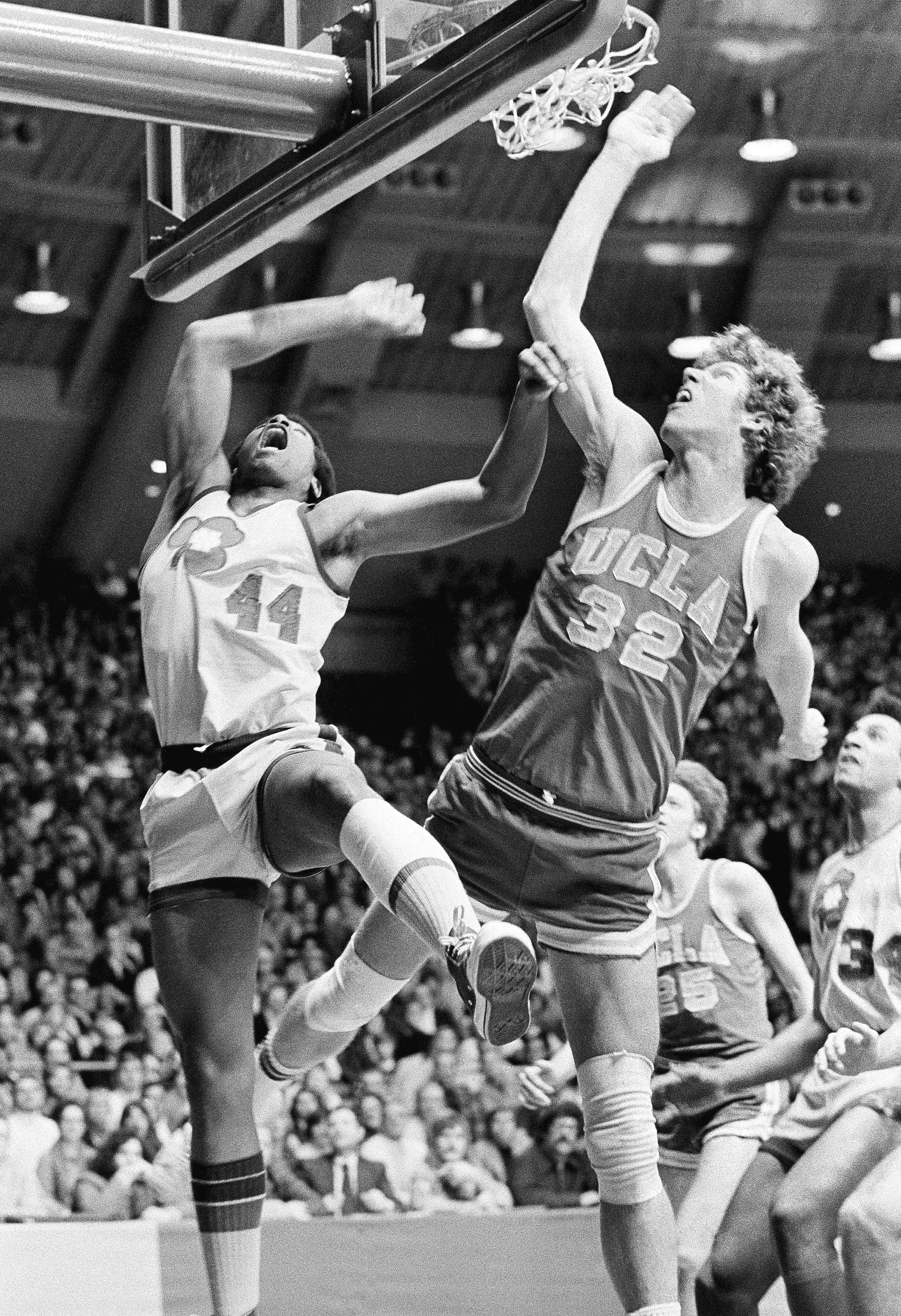 UCLA's Bill Walton (32) fights Notre Dame's Adrian Dantley (44) for a rebound during an NCAA college basketball game in South Bend, Ind., Jan. 19, 1974