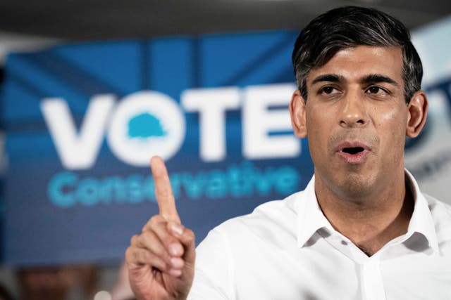 Prime Minister Rishi Sunak speaks during his visit to Amersham and Chiltern RFC (Aaron Chown/PA)