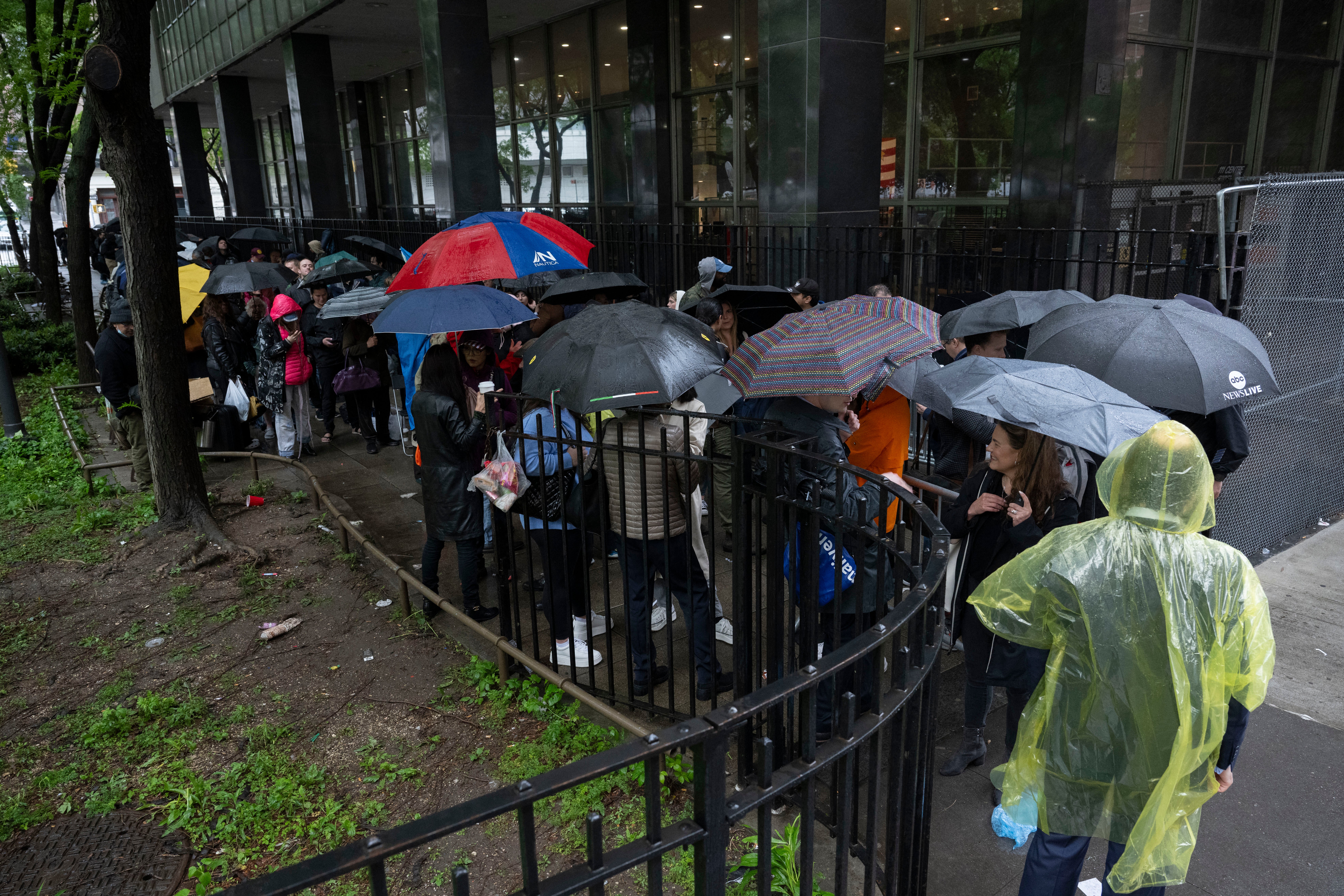 Reporters and members of the public line up across the street from a criminal courthouse in downtown Manhattan for a seat inside Donald Trump’s trial on May 16