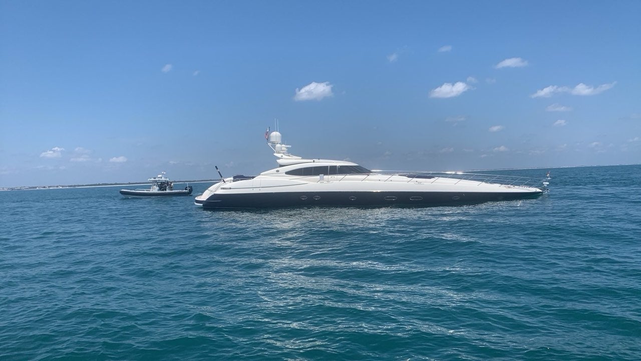 The Atlantis, pictured off the coast of Florida on Saturday, is a superyacht measuring 80-feet. Yachts of that size are typically worth upwards of $1m.