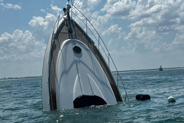 <p>The Atlantis, pictured sinking on Saturday off the coast of Florida, had two passengers on board who were safely rescued by the St John’s County Fire Department</p>