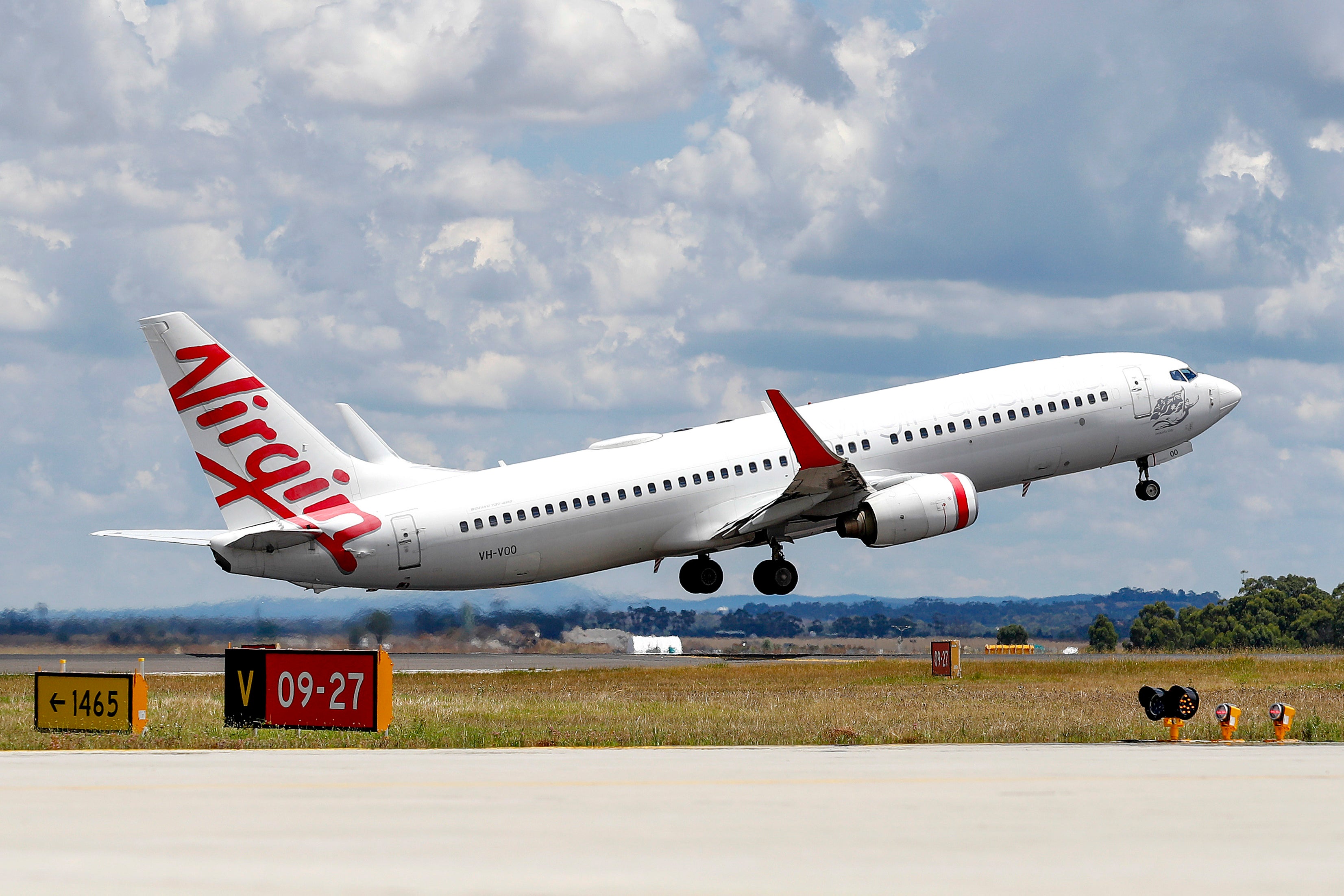 A Virgin Airlines plane takes from Melbourne Airport in Melbourne, Australia, on Jan. 31, 2022
