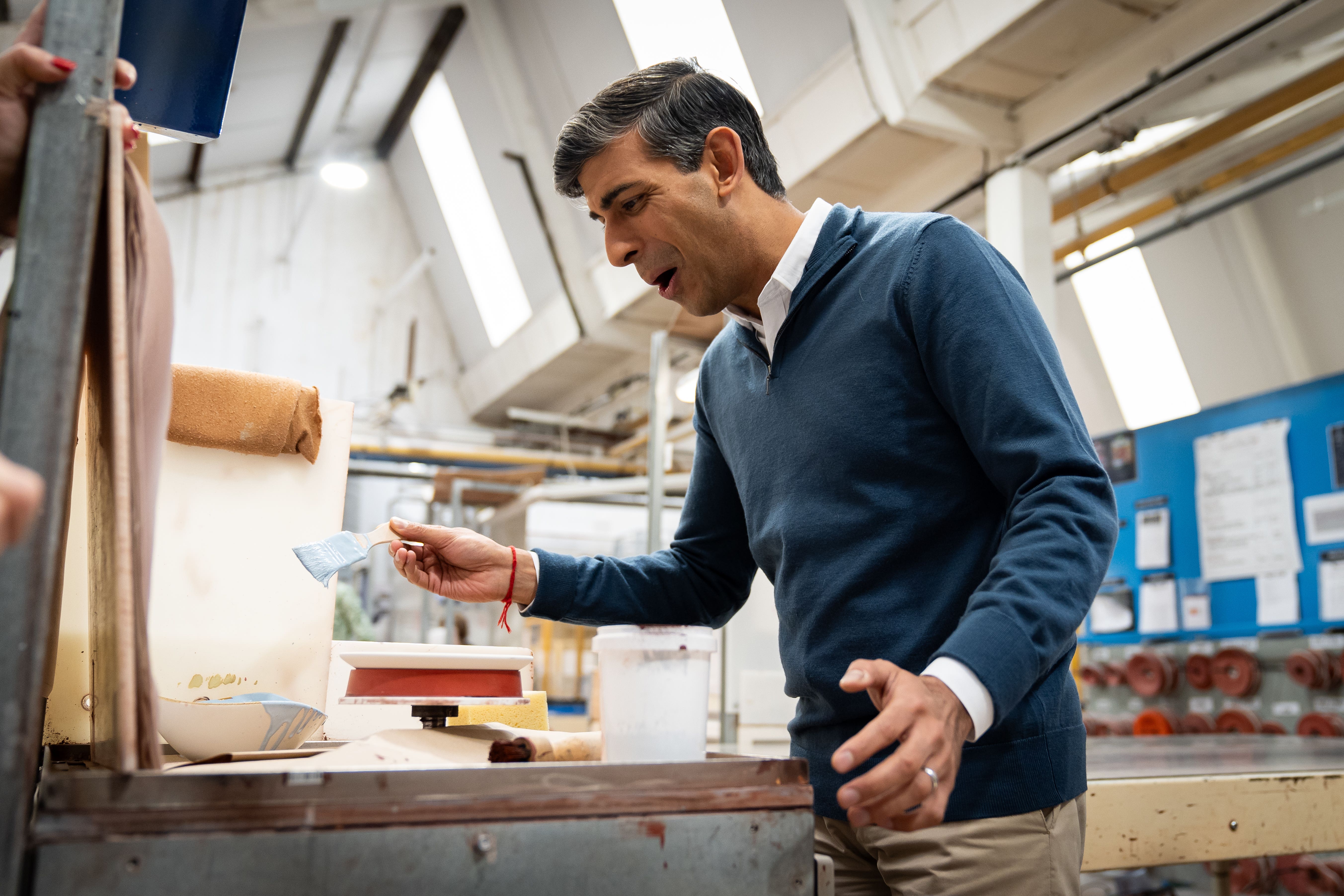 Prime Minister Rishi Sunak was asked for more detail about his plans for a new national service scheme, during a campaign visit to a ceramics factory in Stoke-on-Trent (Aaron Chown/PA)