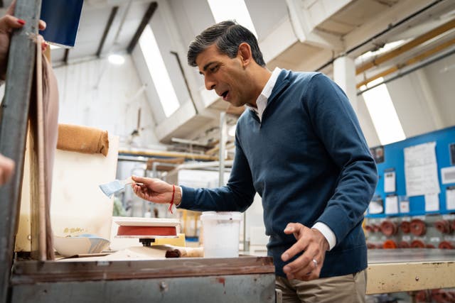 Prime Minister Rishi Sunak was asked for more detail about his plans for a new national service scheme, during a campaign visit to a ceramics factory in Stoke-on-Trent (Aaron Chown/PA)