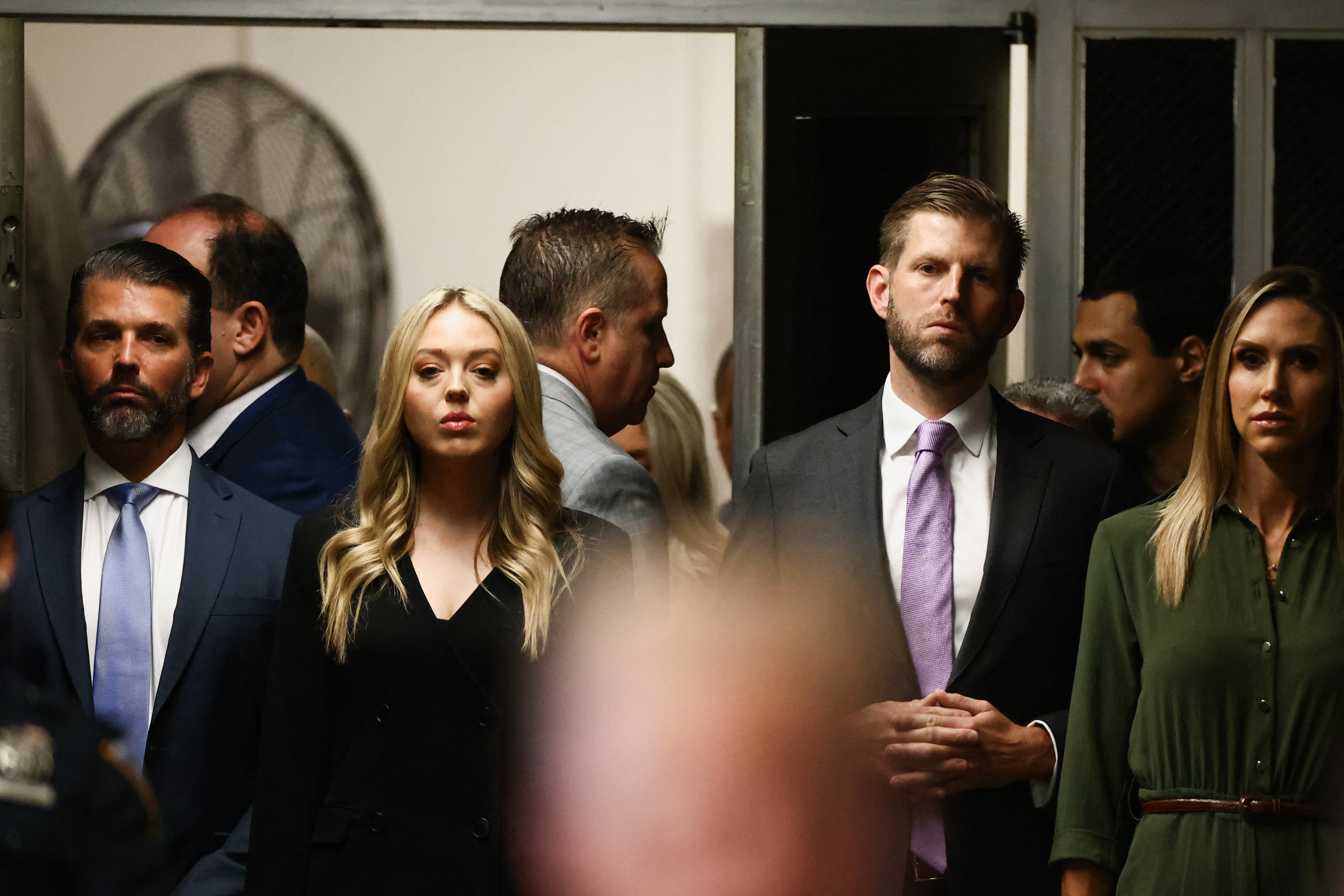 Donald Trump Jr., Tiffany Trump, Eric Trump, and Lara Trump listen to Donald Trump speak to the media on 28 May at Manhattan Criminal Court