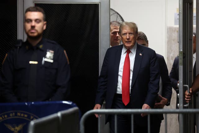 <p>Donald Trump walks into his hush money trial on 28 May. The federal judge in his classified documents case denied a request by Special Counsel Jack Smith to place a gag order on the former president</p>
