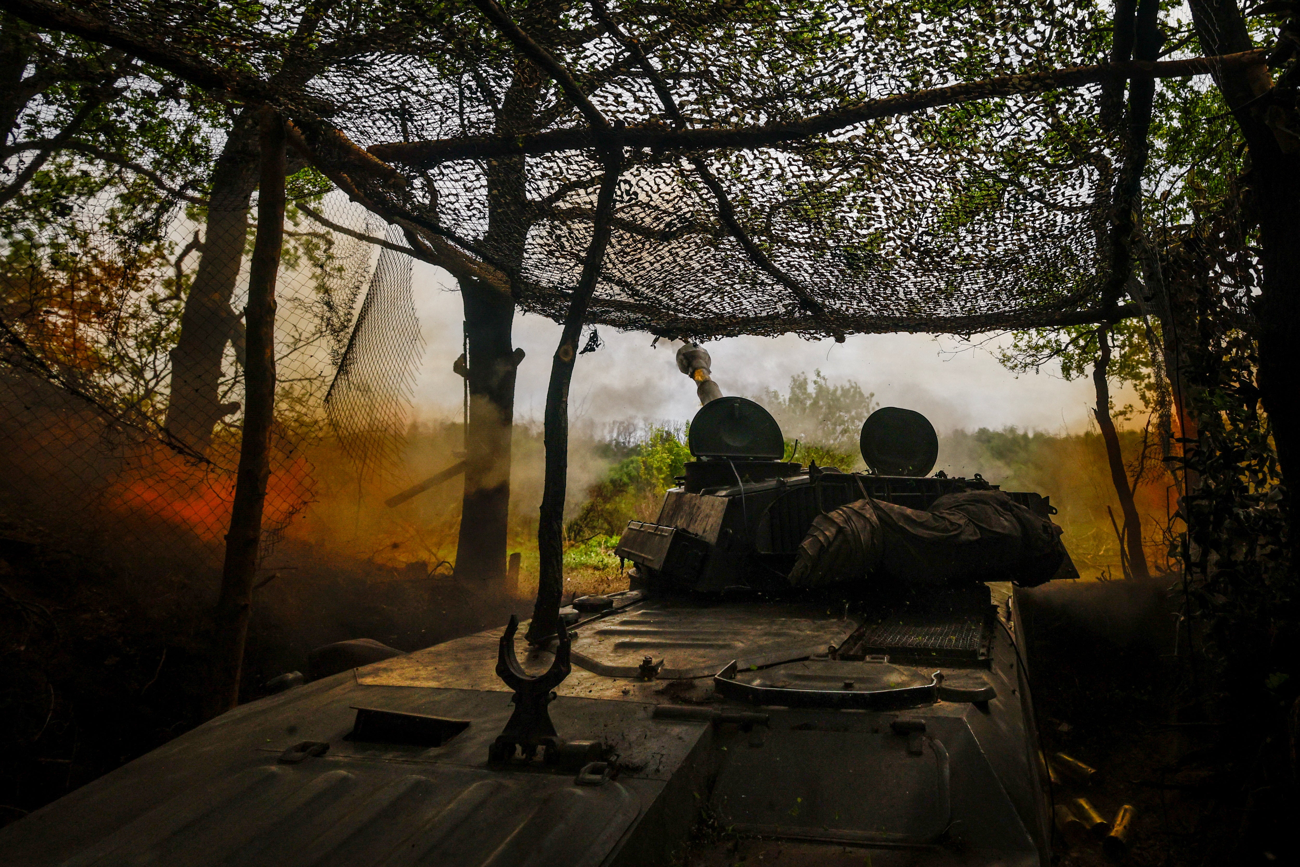 A self-propelled howitzer of Ukraine’s 57th brigade fires in the direction of Russian positions on the outskirts of Kupiansk, Kharkiv region