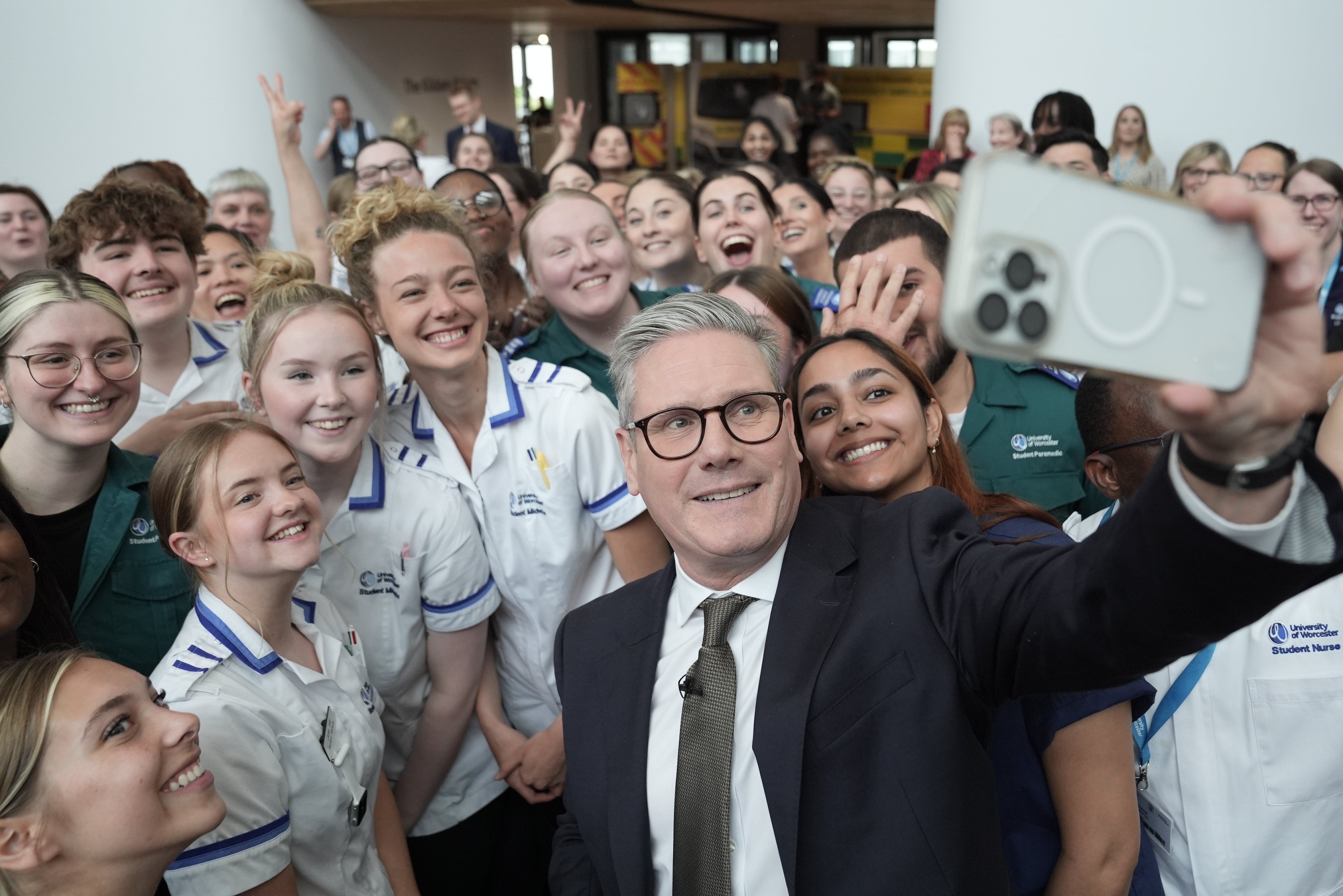 Starmer takes a selfie with student nurses and trainee medics following a Q&A session during a visit to Three Counties Medical School